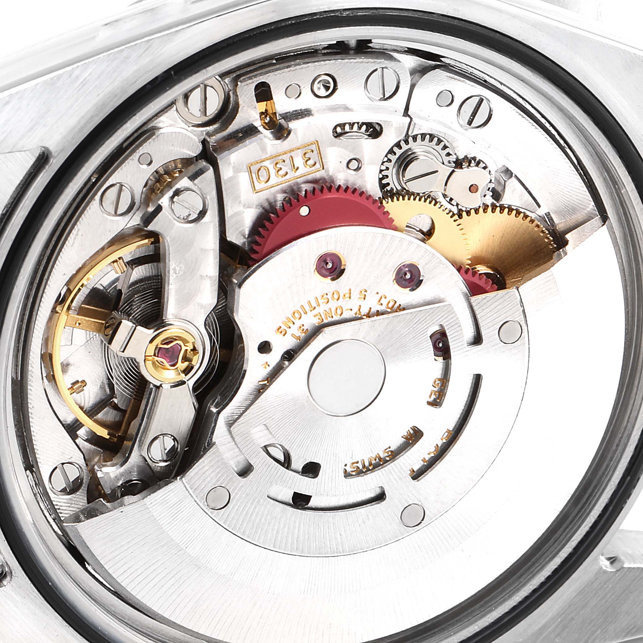 The image shows a close-up of the Rolex Explorer 114270 Men's Stainless Steel Black Dial 114270 Men's Stainless Steel Black Dial model's internal watch mechanism, highlighting gears and intricate components.