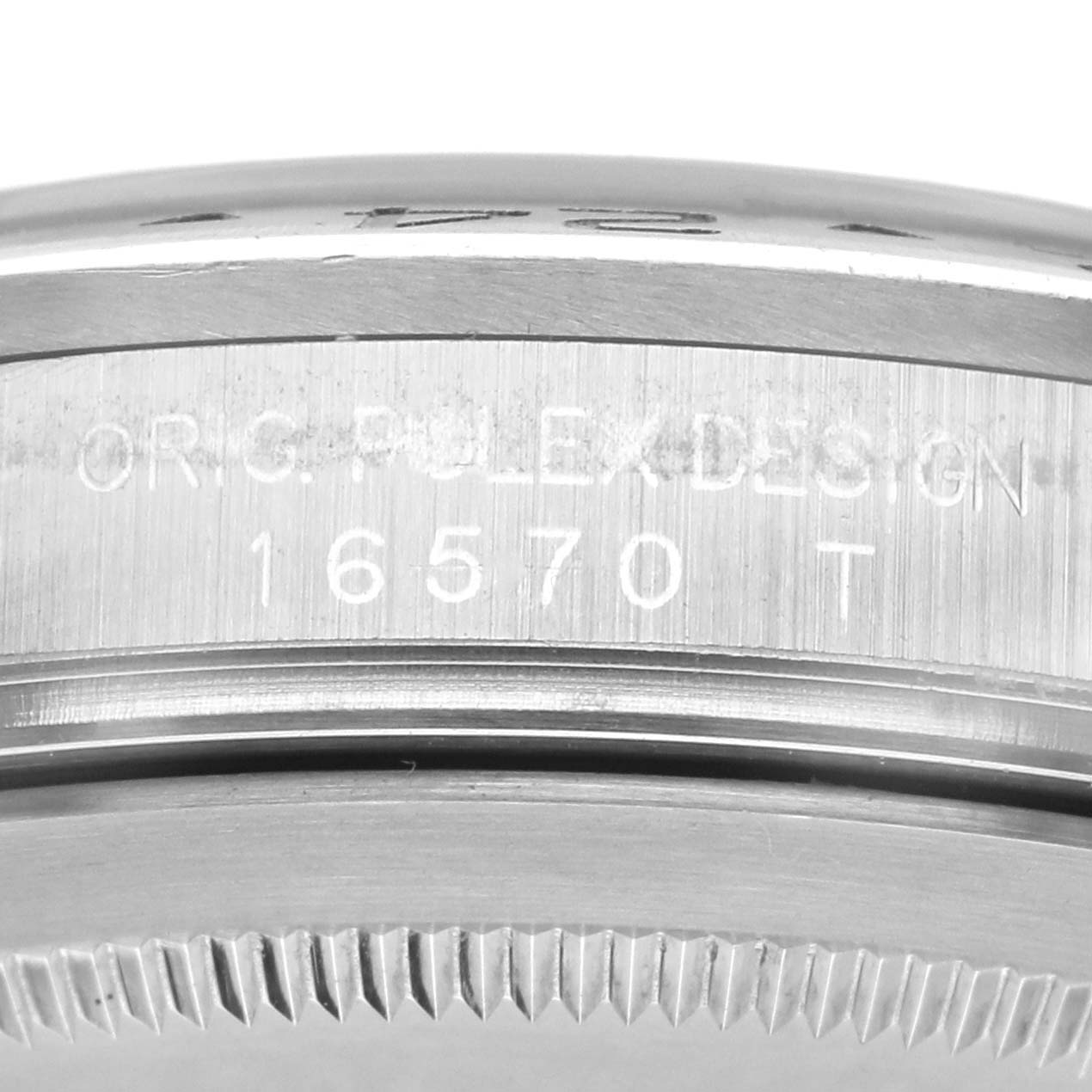 The image shows the side view of a Rolex Explorer 16570 Men's Stainless Steel Black Dial model, focusing on the engraved case details.
