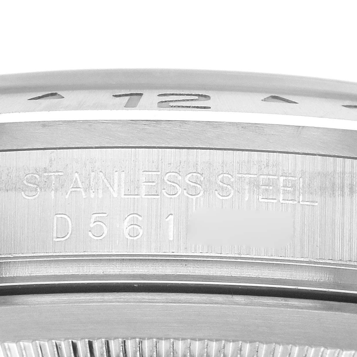 The image shows a close-up of the Rolex Explorer 16570 Men's Stainless Steel Black Dial's stainless steel case side with engraved markings.
