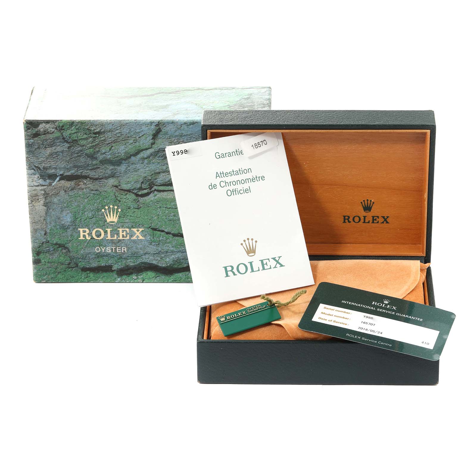 The image shows the Rolex Explorer 16570 Men
s Stainless Steel Black Dial 16570 Men
s Stainless Steel Black Dial model
s box, certification, guarantee papers, and tags.