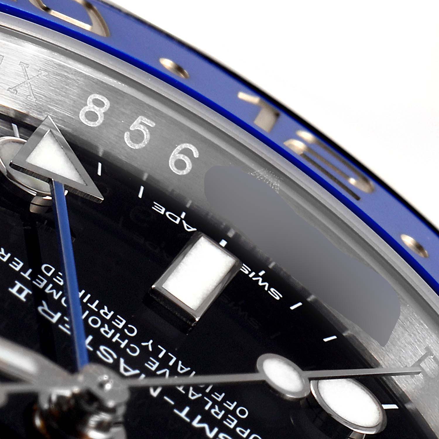 The image shows a close-up angle of a Rolex GMT-Master 116710 Men's Stainless Steel Black Dial 116710 Men's Stainless Steel Black Dial, highlighting part of the bezel, dial, and hour markers.