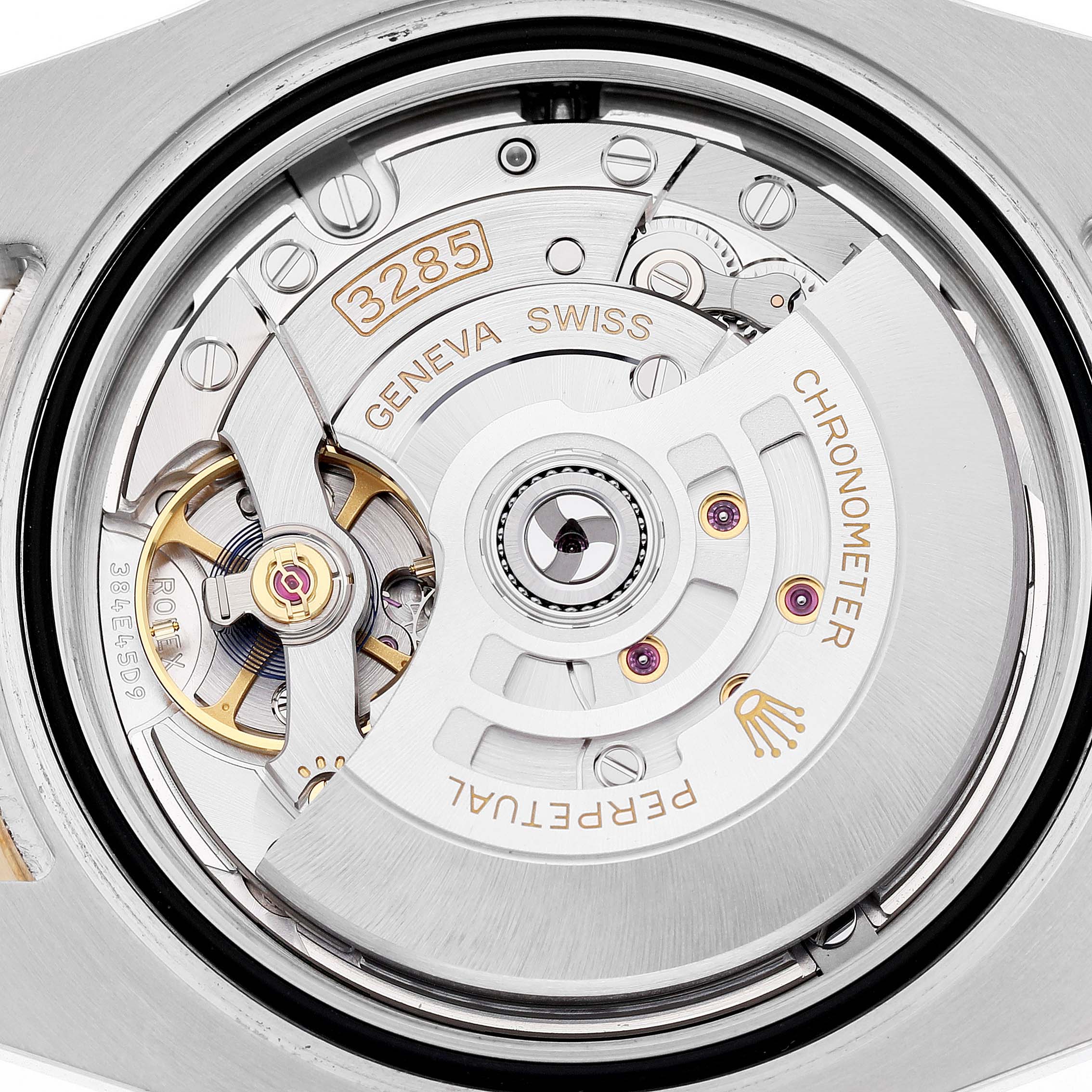 The image shows the movement of the Rolex GMT-Master 126713GRNR Men's Steel and Gold (two tone) Black Dial, highlighting the rotor and intricate components from a top-down view.