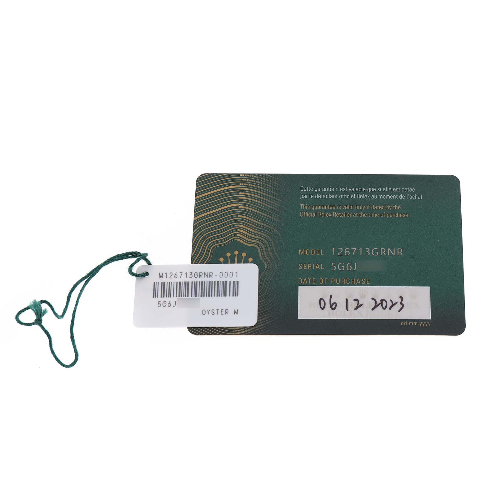 The image shows a Rolex GMT-Master 126713GRNR Men's Steel and Gold (two tone) Black Dial warranty card and hang tag, displaying the model and serial number.