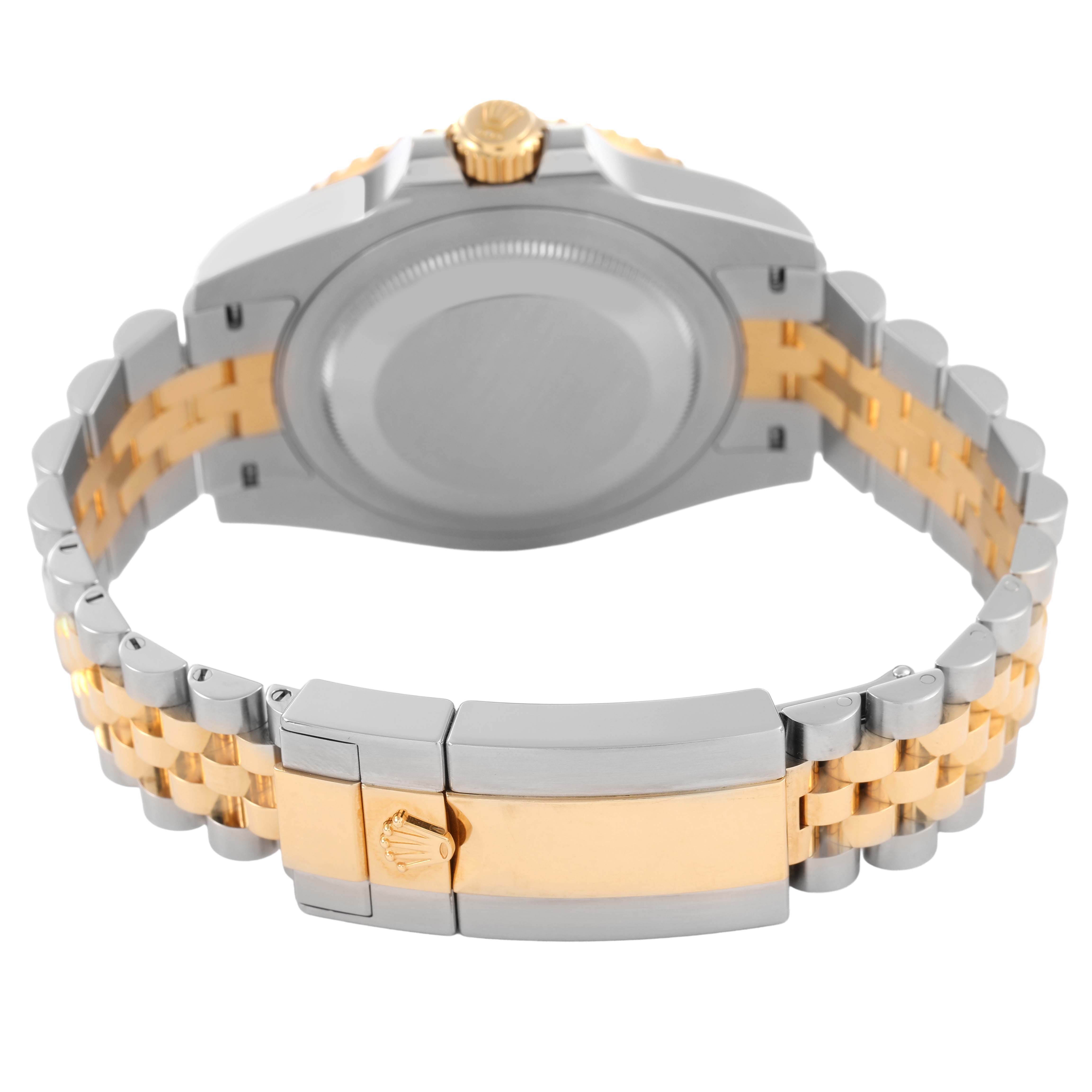 The image shows the back view of a Rolex GMT-Master 126713GRNR Men's Steel and Gold (two tone) Black Dial watch with a two-tone bracelet and clasp.