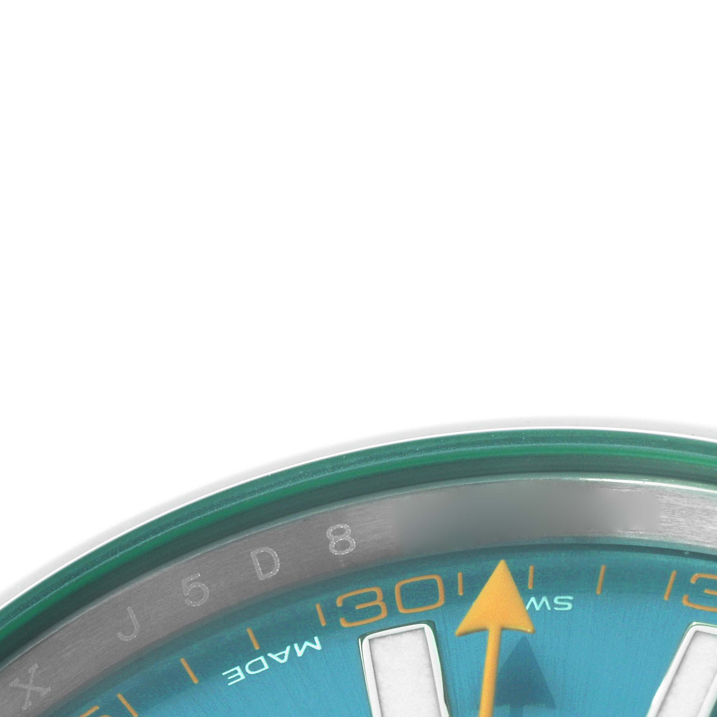 The image shows the upper right section of the Rolex Milgauss 116400 Men's Stainless Steel Blue Dial watch, highlighting part of the dial, minute markers, and orange hand.