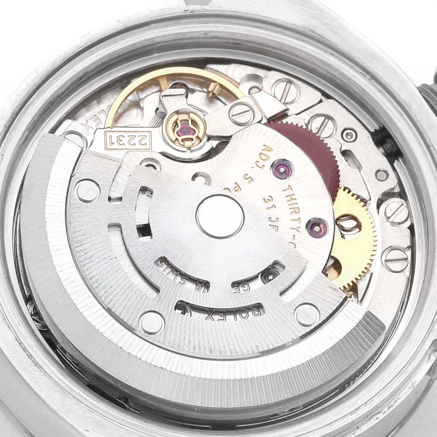 This is a close-up view of the movement mechanism inside the Rolex Oyster Perpetual 176200 Women's Stainless Steel Black Dial 176200 Women's Stainless Steel Black Dial watch.