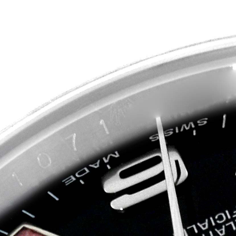 The image shows a close-up of the dial and bezel of the Rolex Oyster Perpetual 176200 Women's Stainless Steel Black Dial 176200 Women's Stainless Steel Black Dial watch, highlighting the "Swiss Made" text and the numeral 9.
