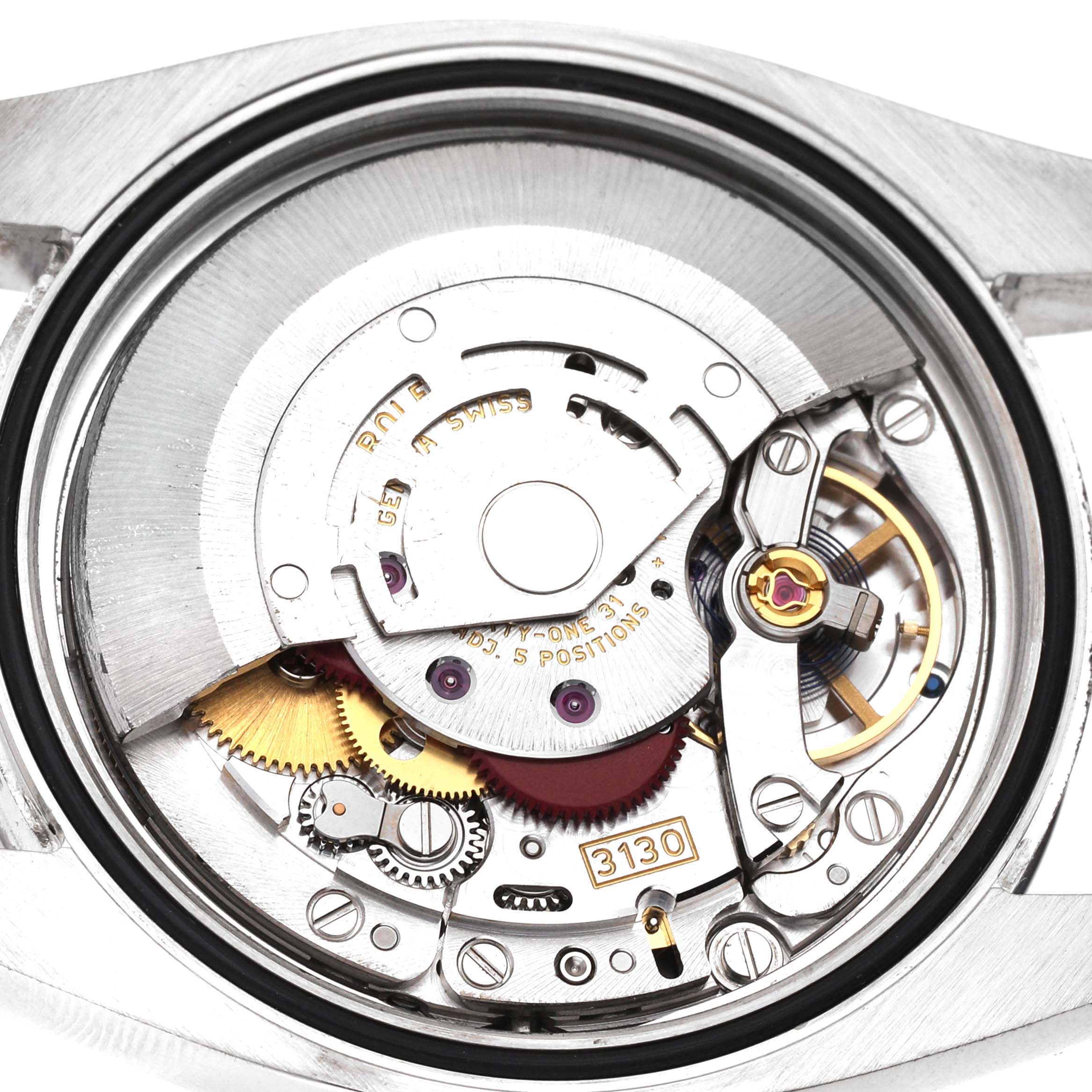 This image shows the internal mechanical movement of a Rolex Oyster Perpetual 116000 Men's Stainless Steel Grey Dial 116000 Men's Stainless Steel Grey Dial watch, including gears and components labeled "3130".