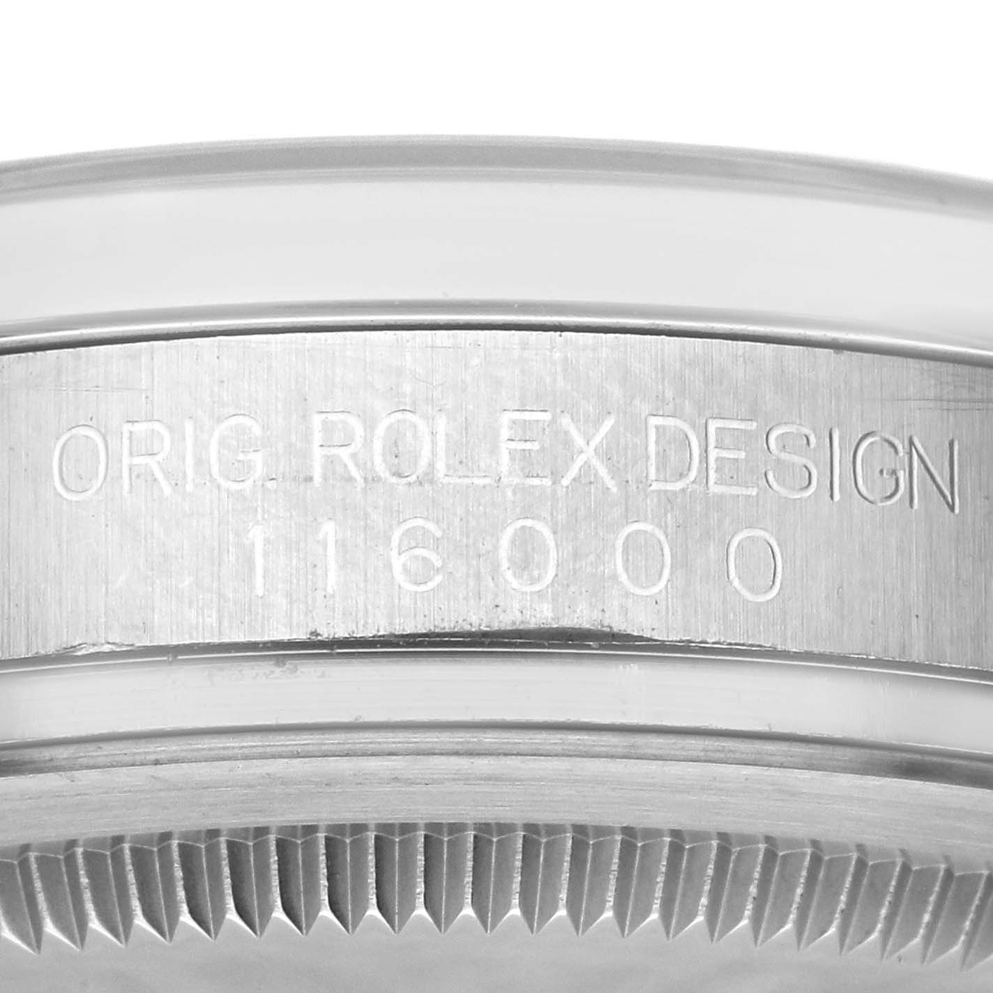 This image shows a close-up of the case side engraving on a Rolex Oyster Perpetual 116000 Men's Stainless Steel Blue Dial 116000 Men's Stainless Steel Blue Dial model with the reference number 116000.