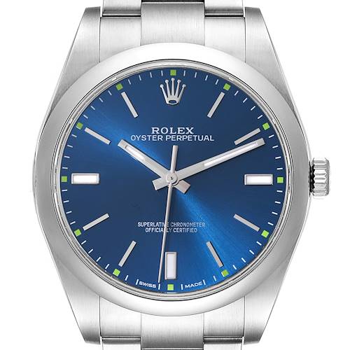 The Rolex Oyster Perpetual watch is shown from a front angle, highlighting its blue dial, crown, and stainless-steel bracelet.