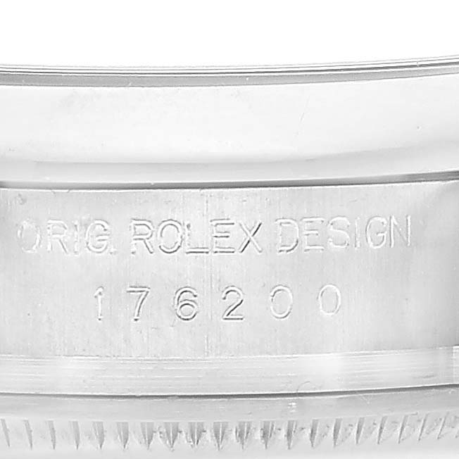 This image shows a close-up view of the engraved side of the case of an Oyster Perpetual model by Rolex.