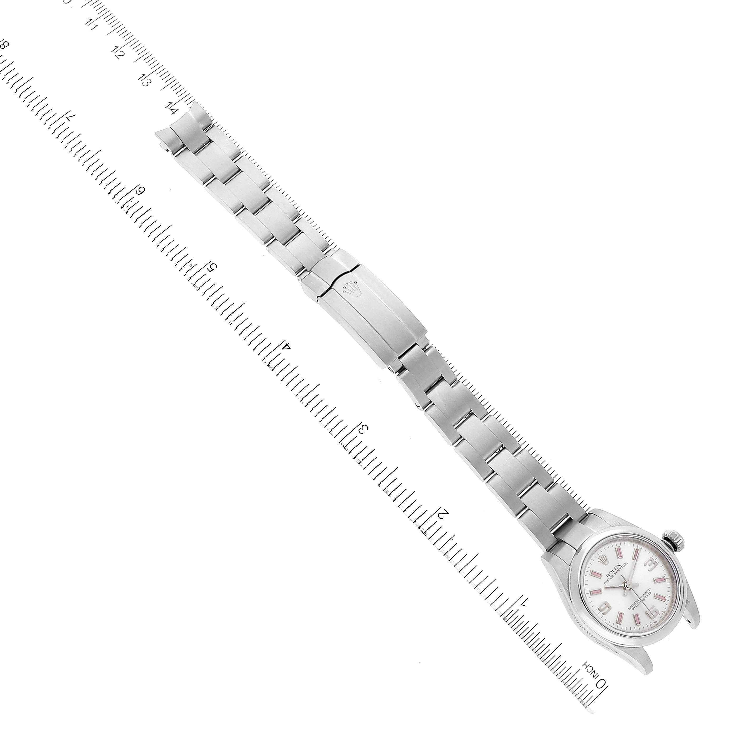 This image shows the Rolex Oyster Perpetual 176200 Women's Stainless Steel Silver Dial 176200 Women's Stainless Steel Silver Dial watch laid flat with the entire bracelet and clasp visible, aligned with a ruler for scale.
