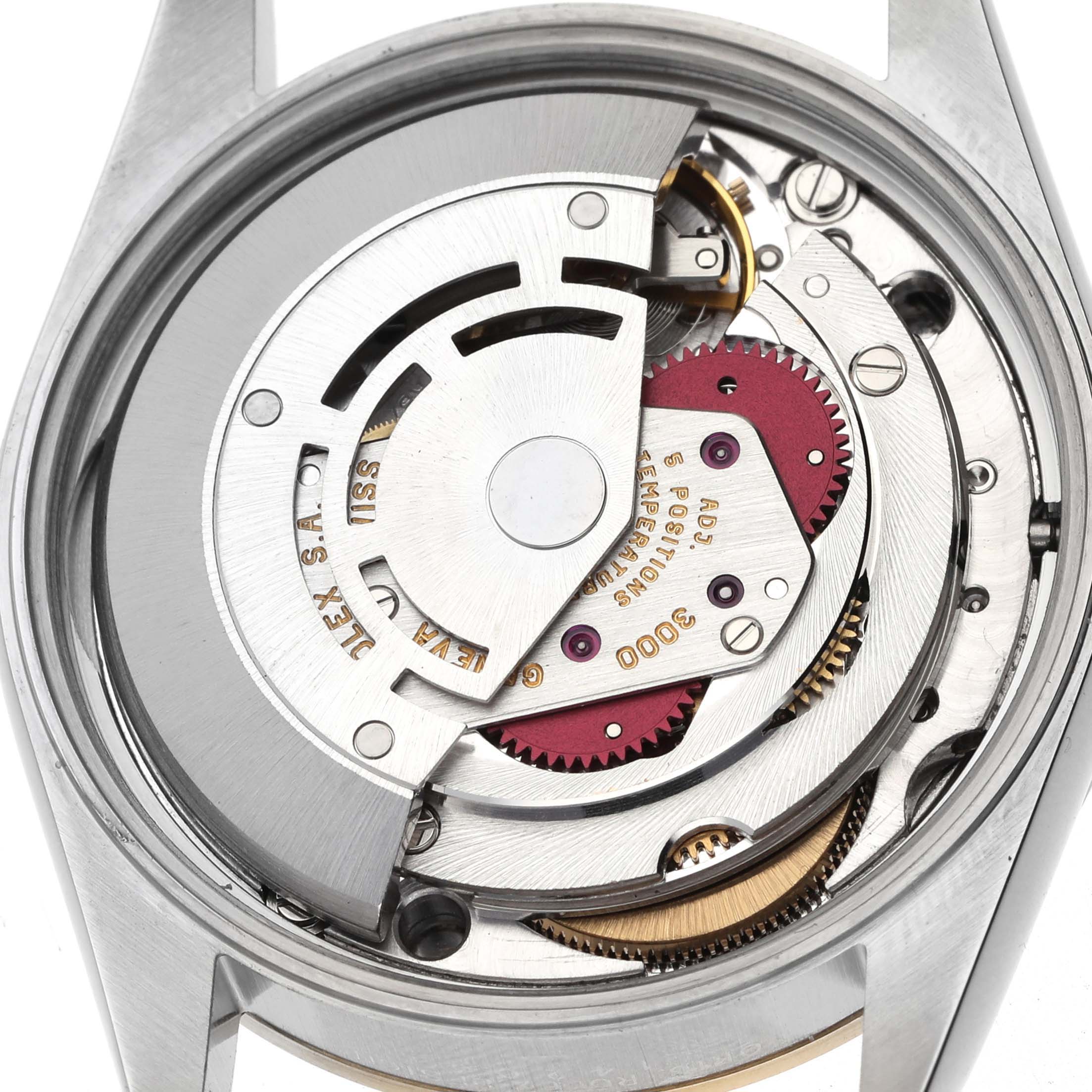 The image shows an aerial view of the Rolex Oyster Perpetual 14203 Men's Steel and Gold (two tone) Grey Dial's movement and internal mechanics.