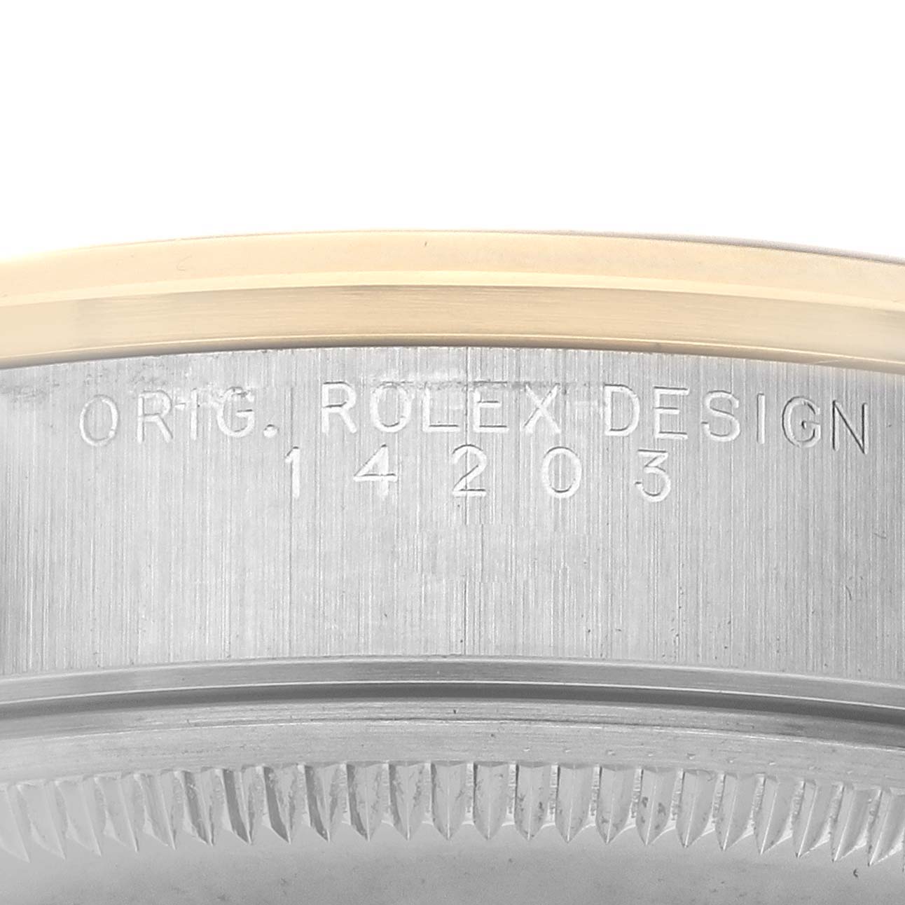 The image shows a close-up side view of the bezel and edge of the case back of a Rolex Oyster Perpetual 14203 Men's Steel and Gold (two tone) Grey Dial watch, highlighting the engraved design number.