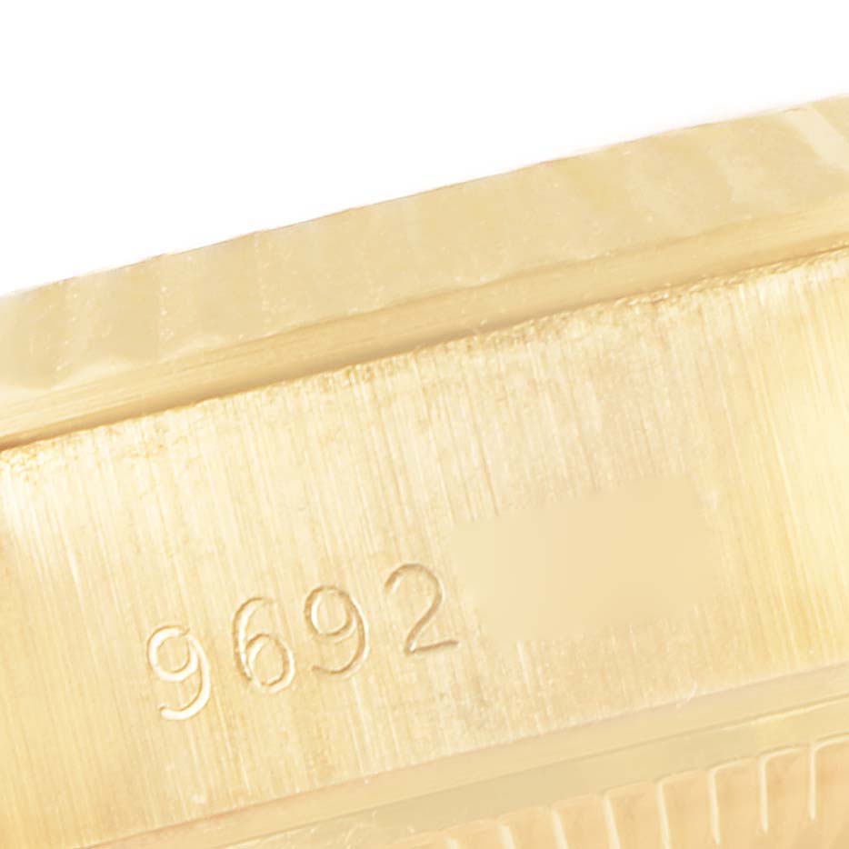 This image shows a close-up of a serial number engraved on the side of a Rolex President 69178 Women
s Yellow Gold Champagne Dial 69178 Women
s Yellow Gold Champagne Dial model timepiece.