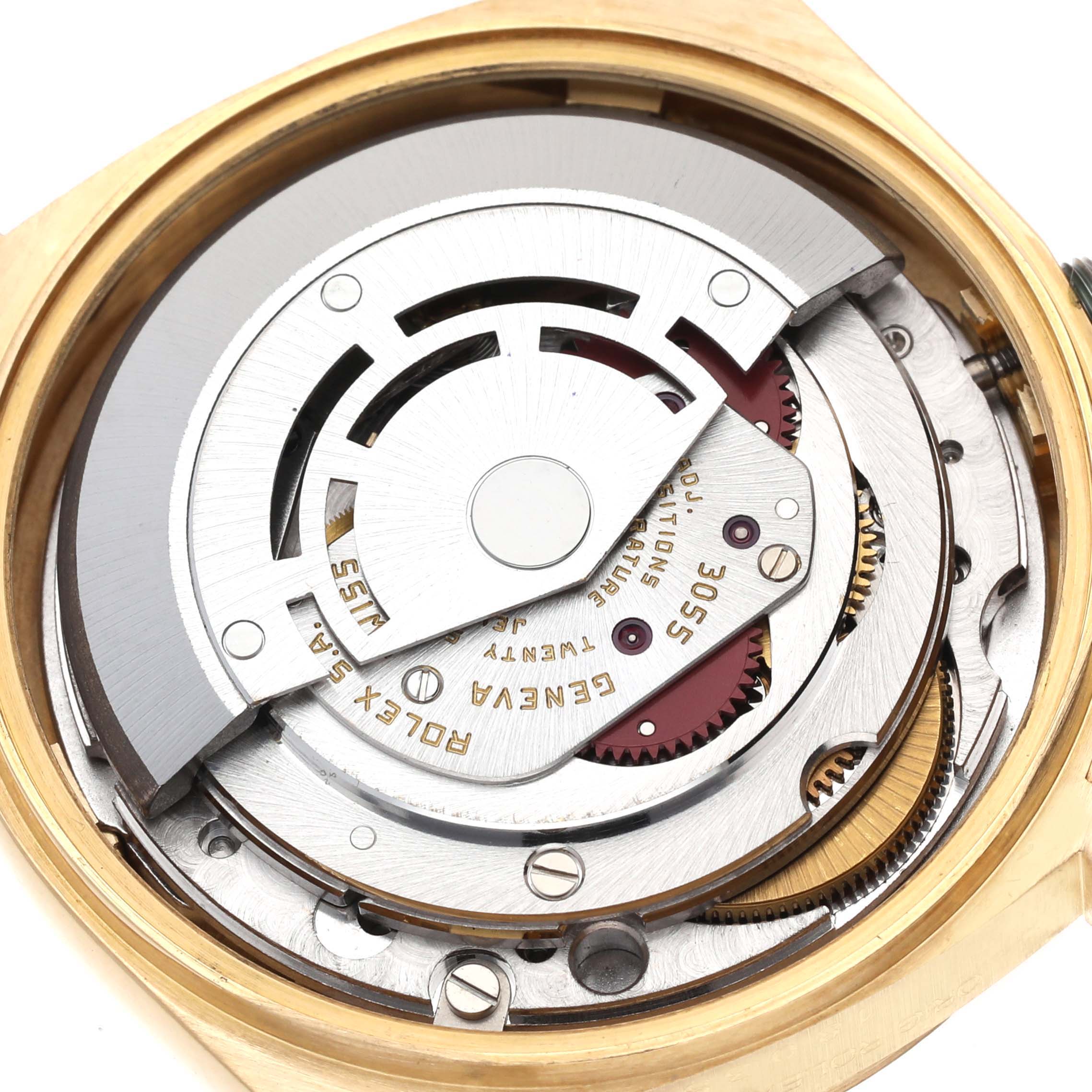 The image shows the Rolex President 18038 Men
s Yellow Gold Champagne Dial 18038 Men
s Yellow Gold Champagne Dial model
s movement from a top-down angle, highlighting the intricate inner mechanisms.