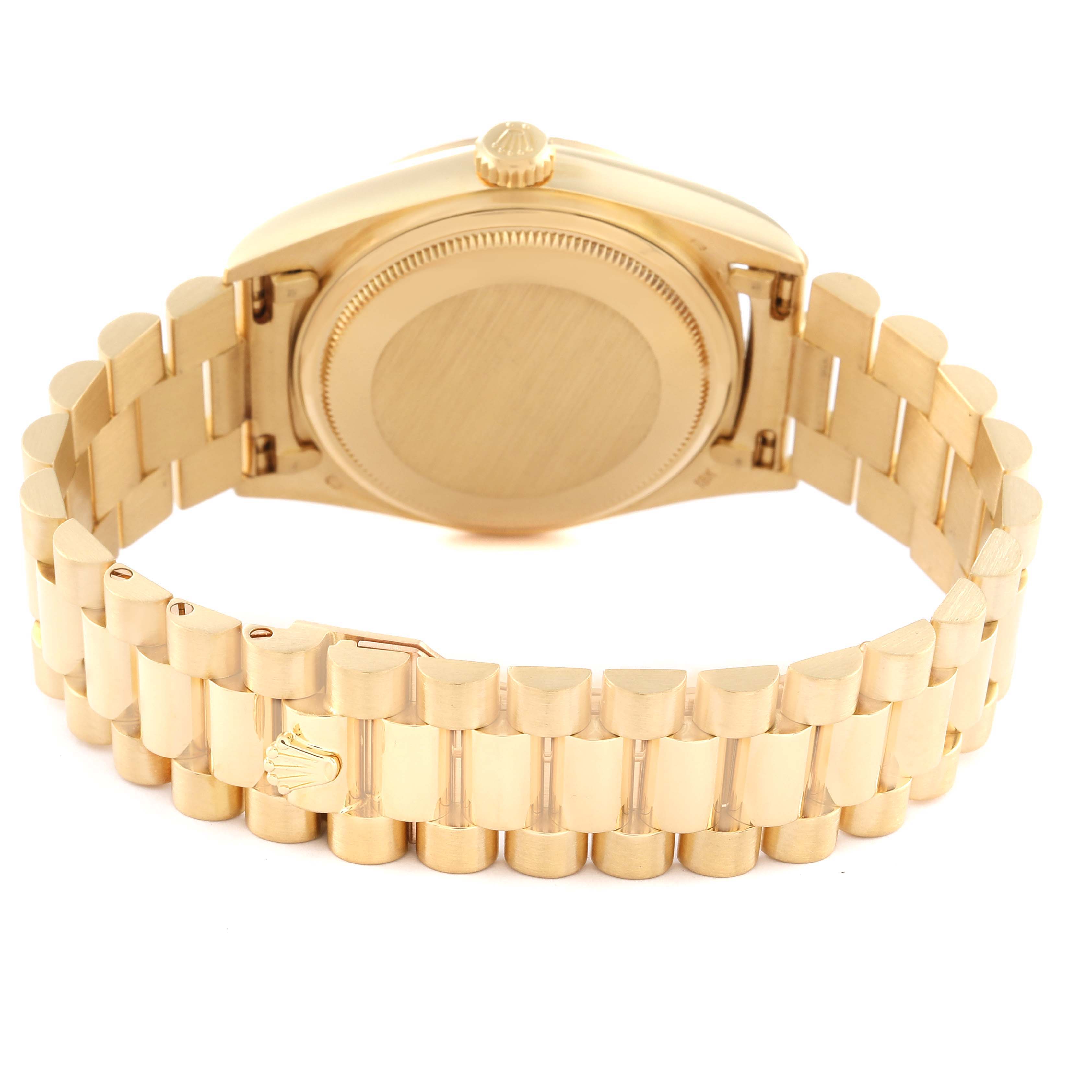 The image shows the back side and bracelet of a Rolex President 18038 Men
s Yellow Gold Champagne Dial 18038 Men
s Yellow Gold Champagne Dial model watch, viewed from an opened position.