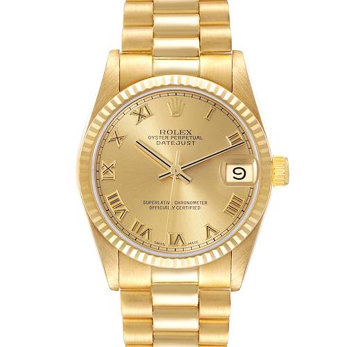 This image shows a gold-tone Rolex President model watch viewed from the front, featuring a fluted bezel and Roman numeral markers.