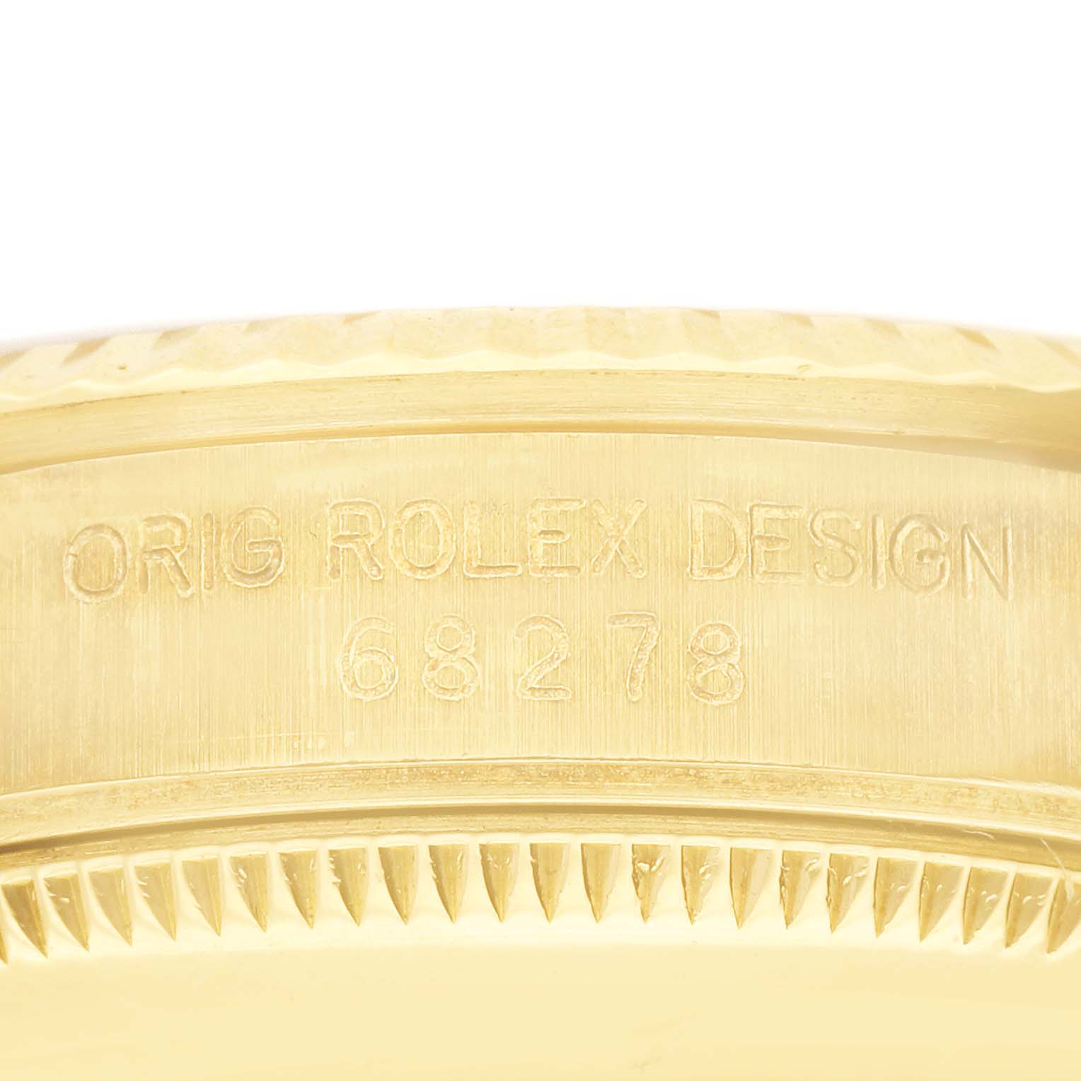 This close-up image shows the engraved model number and "ORIG ROLEX DESIGN" text on the case of the Rolex President 68278 Women's Yellow Gold Champagne Dial 68278 Women's Yellow Gold Champagne Dial watch.