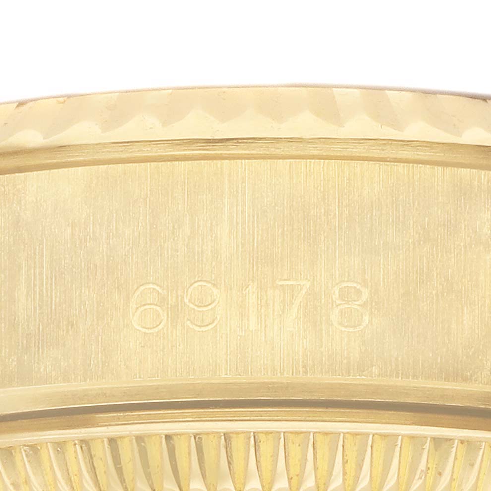 The image shows a close-up of the side of a Rolex President 69178 Women's Yellow Gold Champagne Dial watch, highlighting the model number engraving.