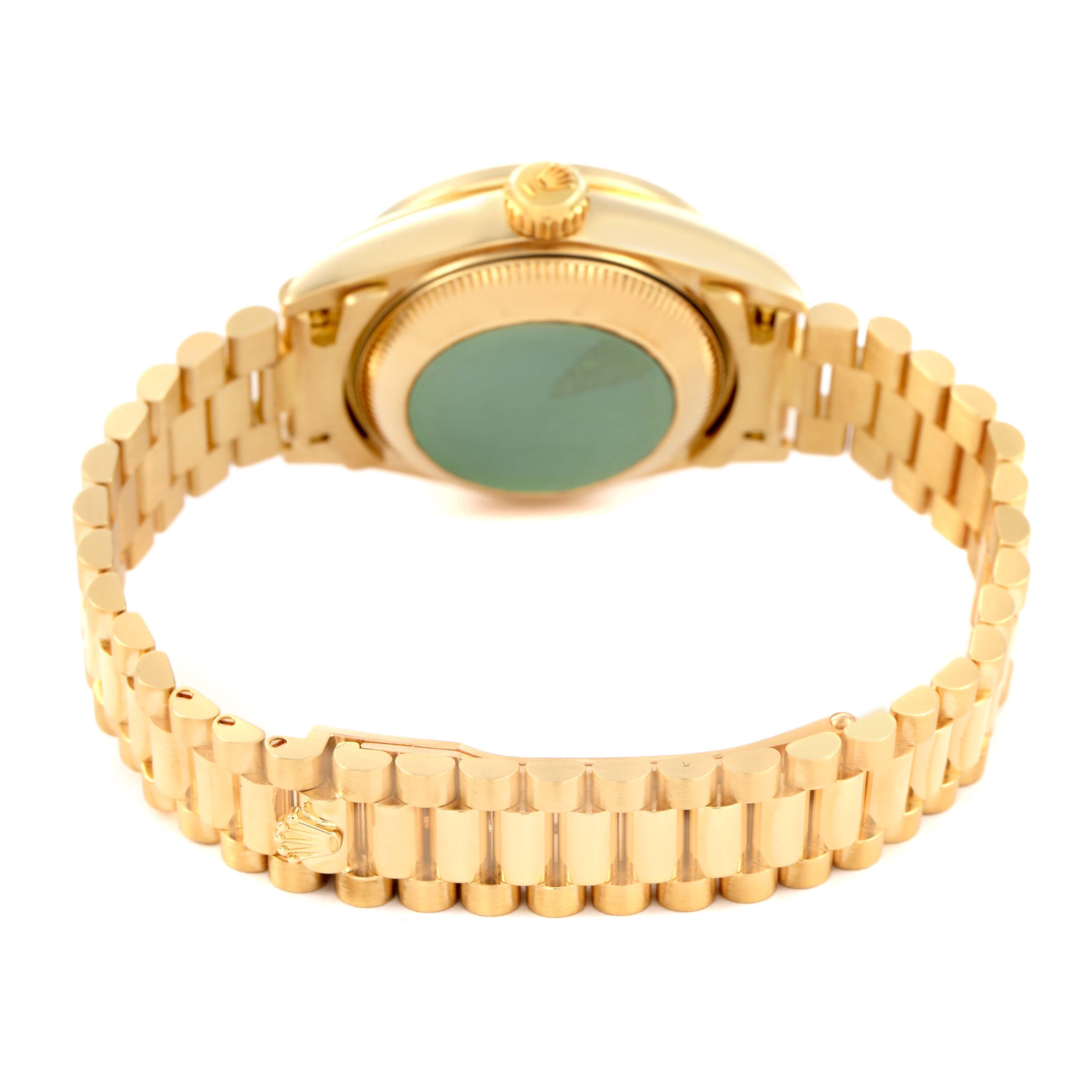 The Rolex President 69158 Women's Yellow Gold Mother of Pearl Dial model is shown from the back, highlighting the case back, crown, and bracelet.