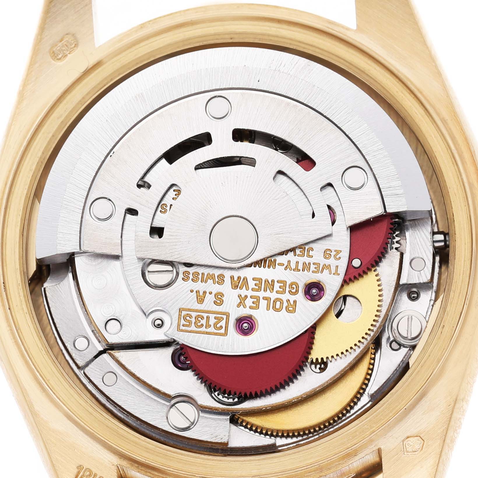 The image shows the movement of a Rolex President 69158 Women's Yellow Gold Mother of Pearl Dial model watch from the back, highlighting the gears and inscriptions.