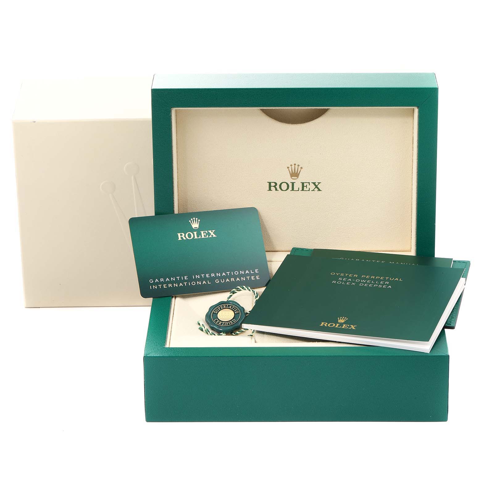 The image shows the packaging, warranty card, and a booklet for the Rolex Sea-Dweller 126660 Men's Stainless Steel Blue Dial 126660 Men's Stainless Steel Blue Dial watch.