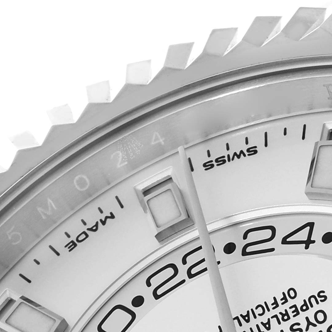This close-up image of the Rolex Sky-Dweller 326934 Men's Stainless Steel Silver Dial 326934 Men's Stainless Steel Silver Dial model shows part of the bezel, dial, and hour markers.
