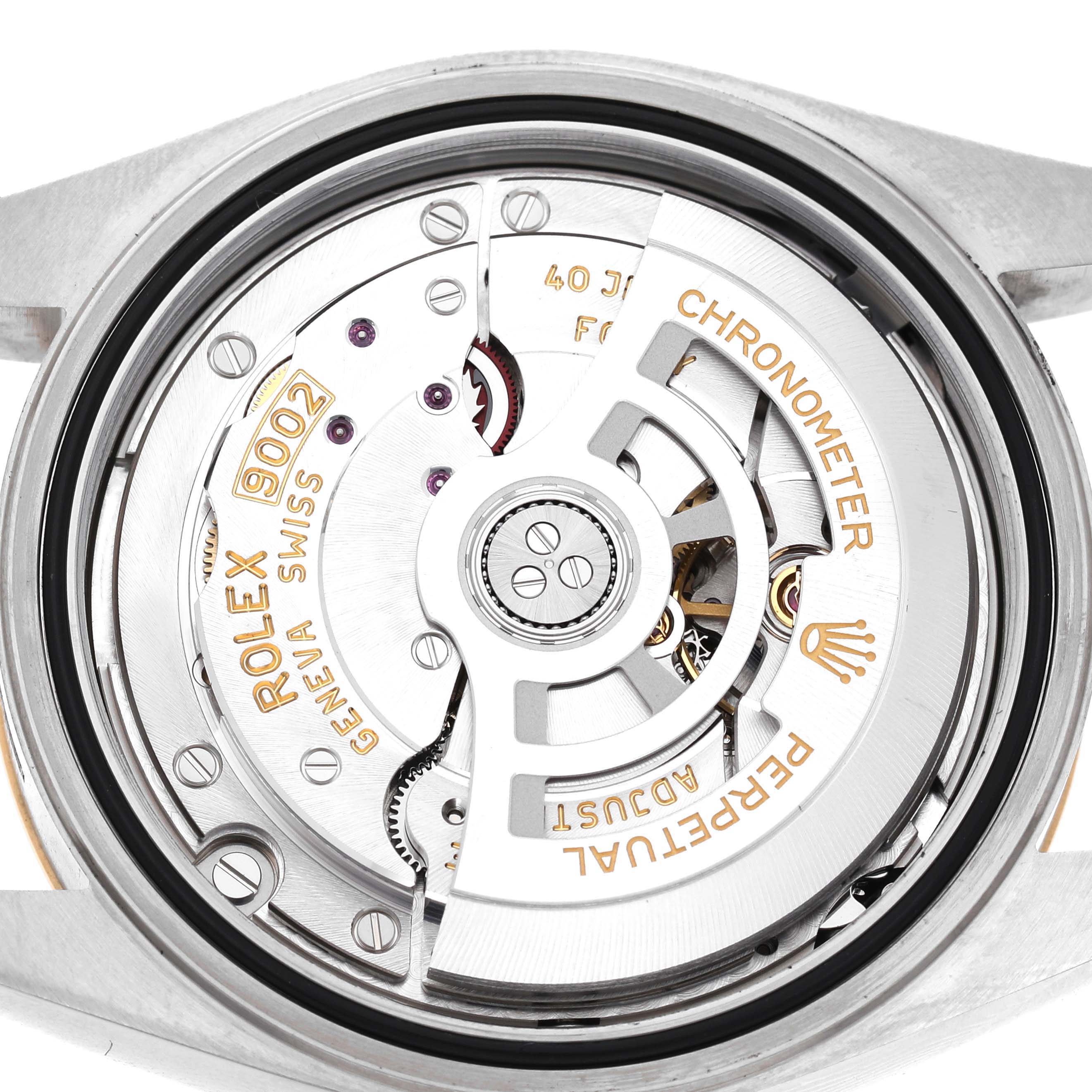 The image shows the movement of the Rolex Sky-Dweller 336933 Men's Steel and Gold (two tone) Black Dial watch from a top-down angle, highlighting the intricate rotor and mechanics.