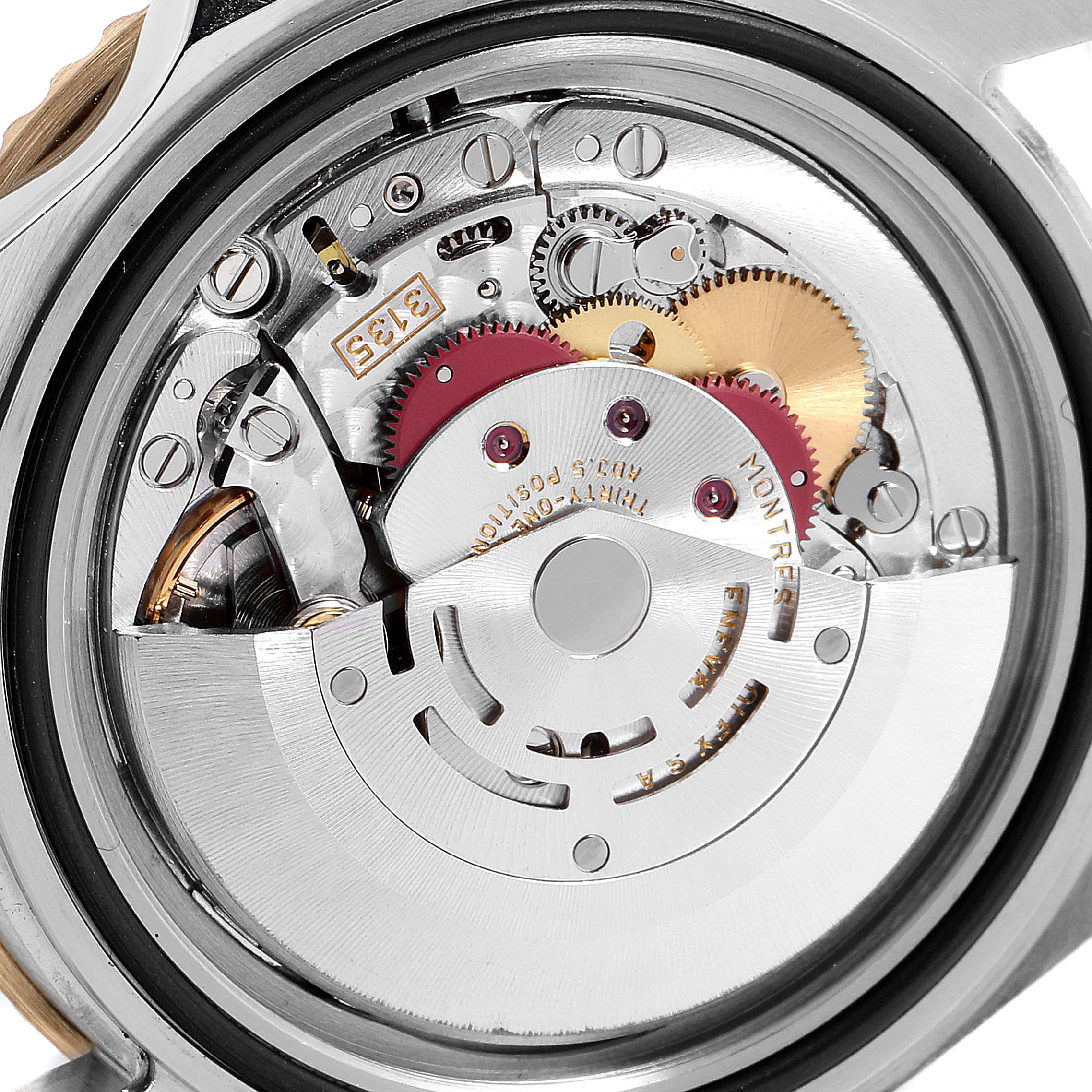 This image shows the intricate movement and mechanical gears of a Rolex Submariner 16613 Men
s Steel and Gold (two tone) Blue Dial 16613 Men
s Steel and Gold (two tone) Blue Dial watch from a close-up, rear angle.