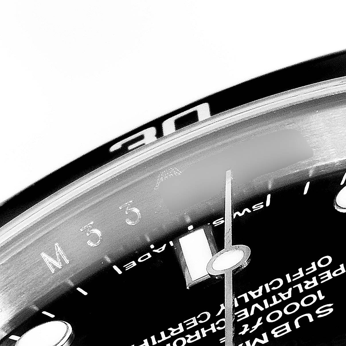 The image shows a close-up of the bezel, dial, and part of the minute hand of the Rolex Submariner 14060M Men's Stainless Steel Black Dial 14060M Men's Stainless Steel Black Dial watch.