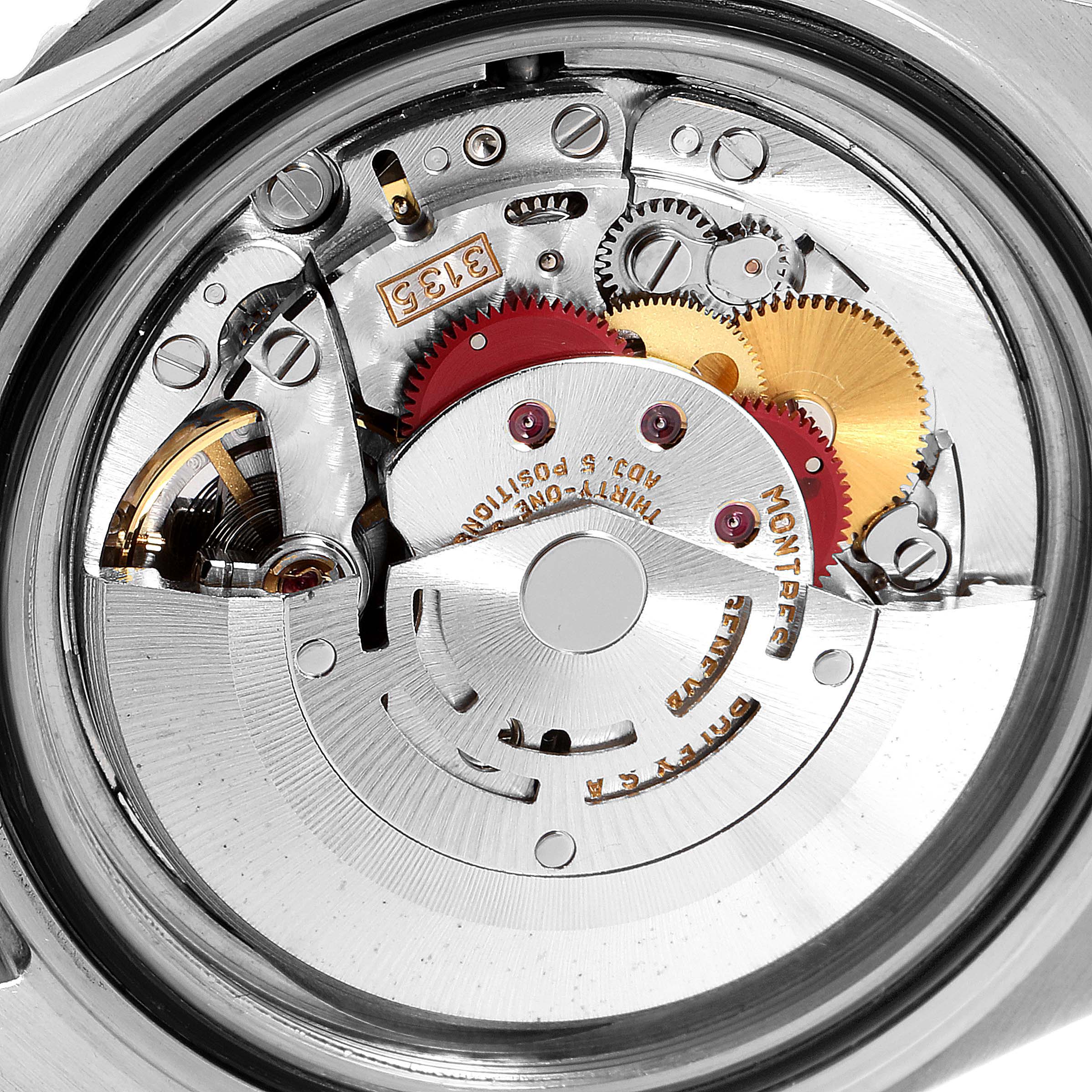 This image shows a close-up view of the internal mechanism of a Rolex Submariner 16610 Men's Stainless Steel Black Dial 16610 Men's Stainless Steel Black Dial watch, focusing on its intricate gears and components.