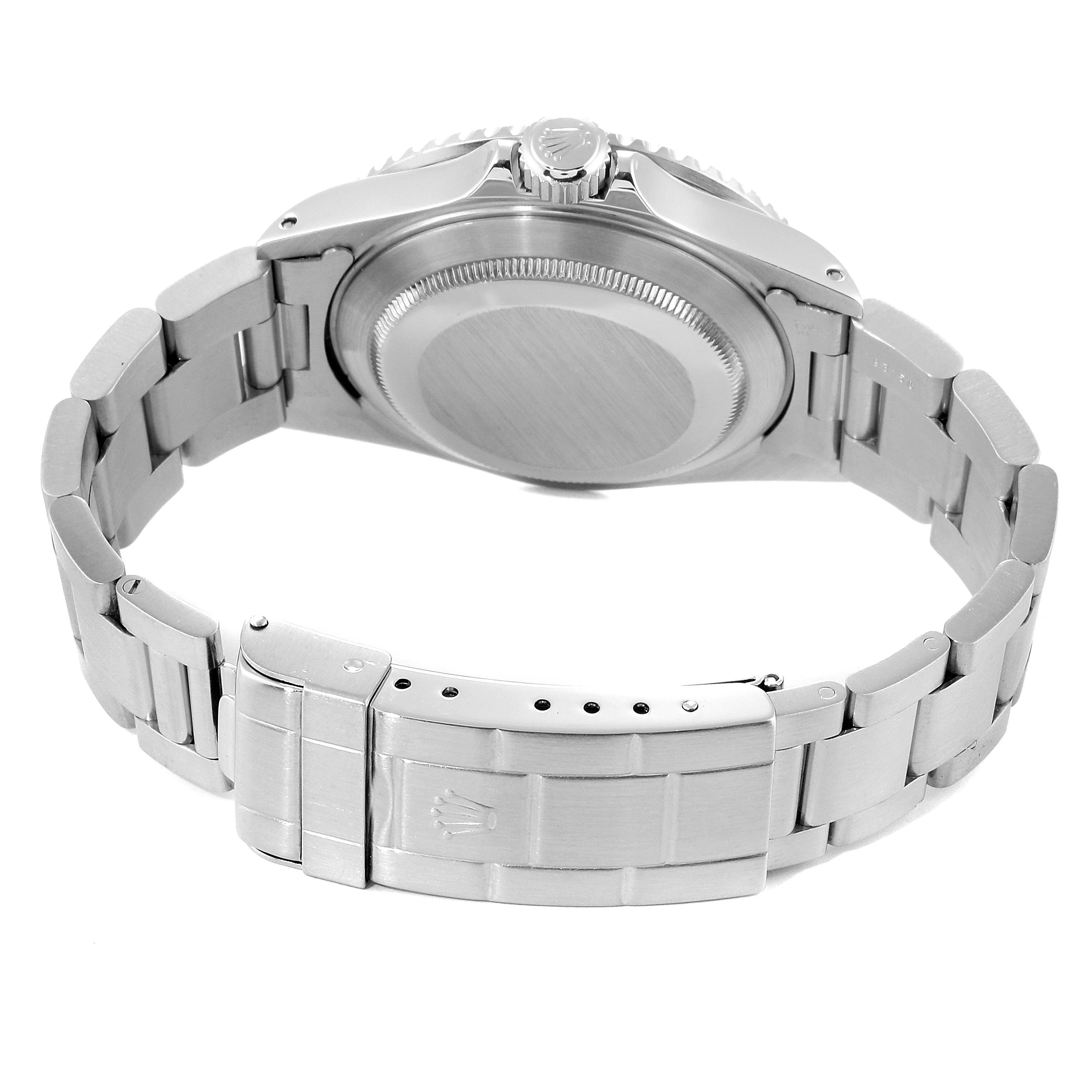 This image shows the back, bracelet, and clasp of a Rolex Submariner 16610 Men's Stainless Steel Black Dial 16610 Men's Stainless Steel Black Dial watch from a slightly angled top-down view.