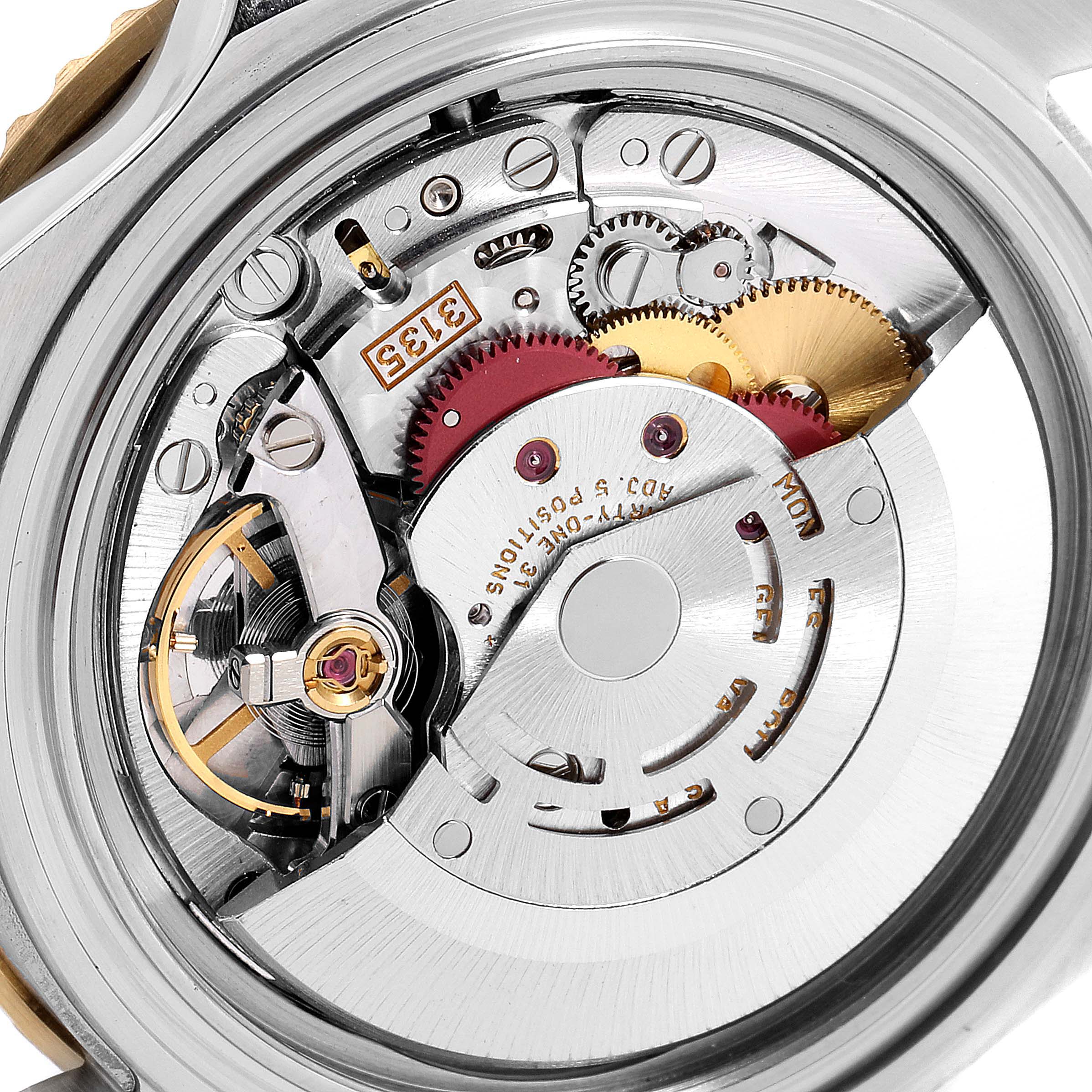 The image shows a close-up view of the movement and internal mechanism of a Rolex Submariner 16613 Men
s Steel and Gold (two tone) Blue Dial 16613 Men
s Steel and Gold (two tone) Blue Dial watch.