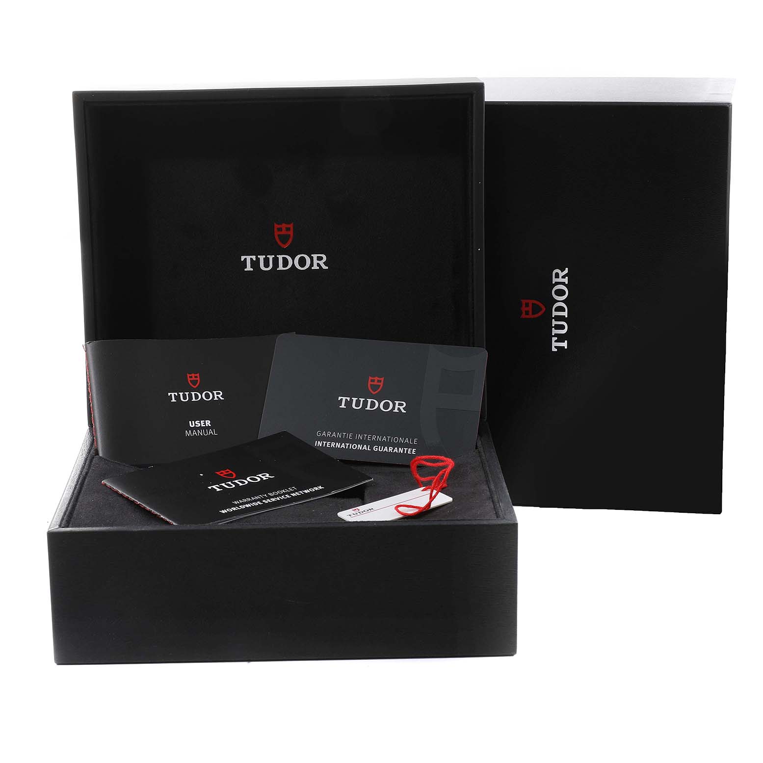 The image shows the packaging, user manual, and international guarantee documents for a Tudor Heritage Black Bay 79830RB Men's Stainless Steel Black Dial 79830RB Men's Stainless Steel Black Dial watch.