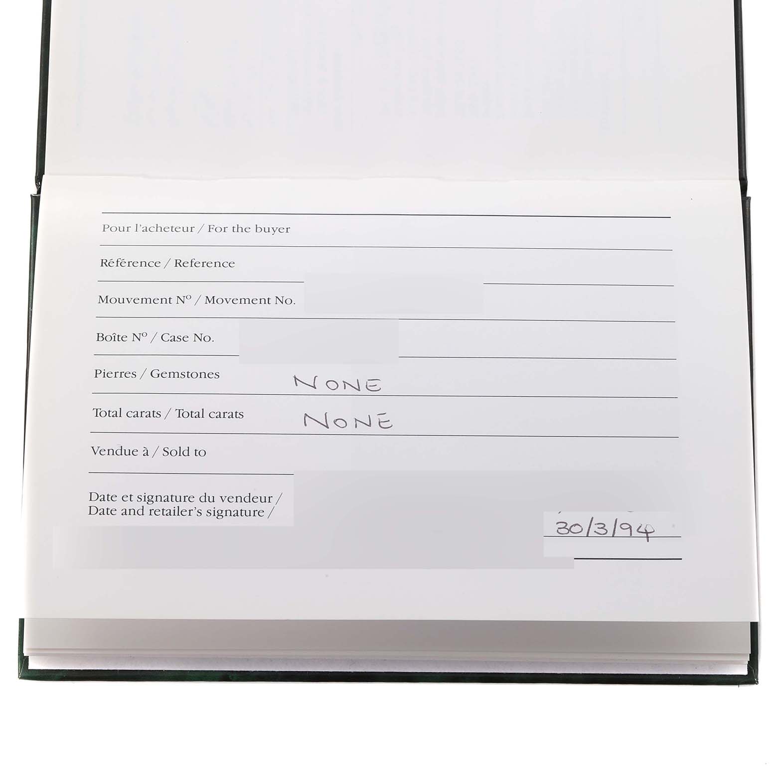 The image shows an open warranty or Best Quality
ation book for an Audemars Piguet Royal Oak 25730BA Men
s Yellow Gold Silver Dial 25730BA Men
s Yellow Gold Silver Dial watch.