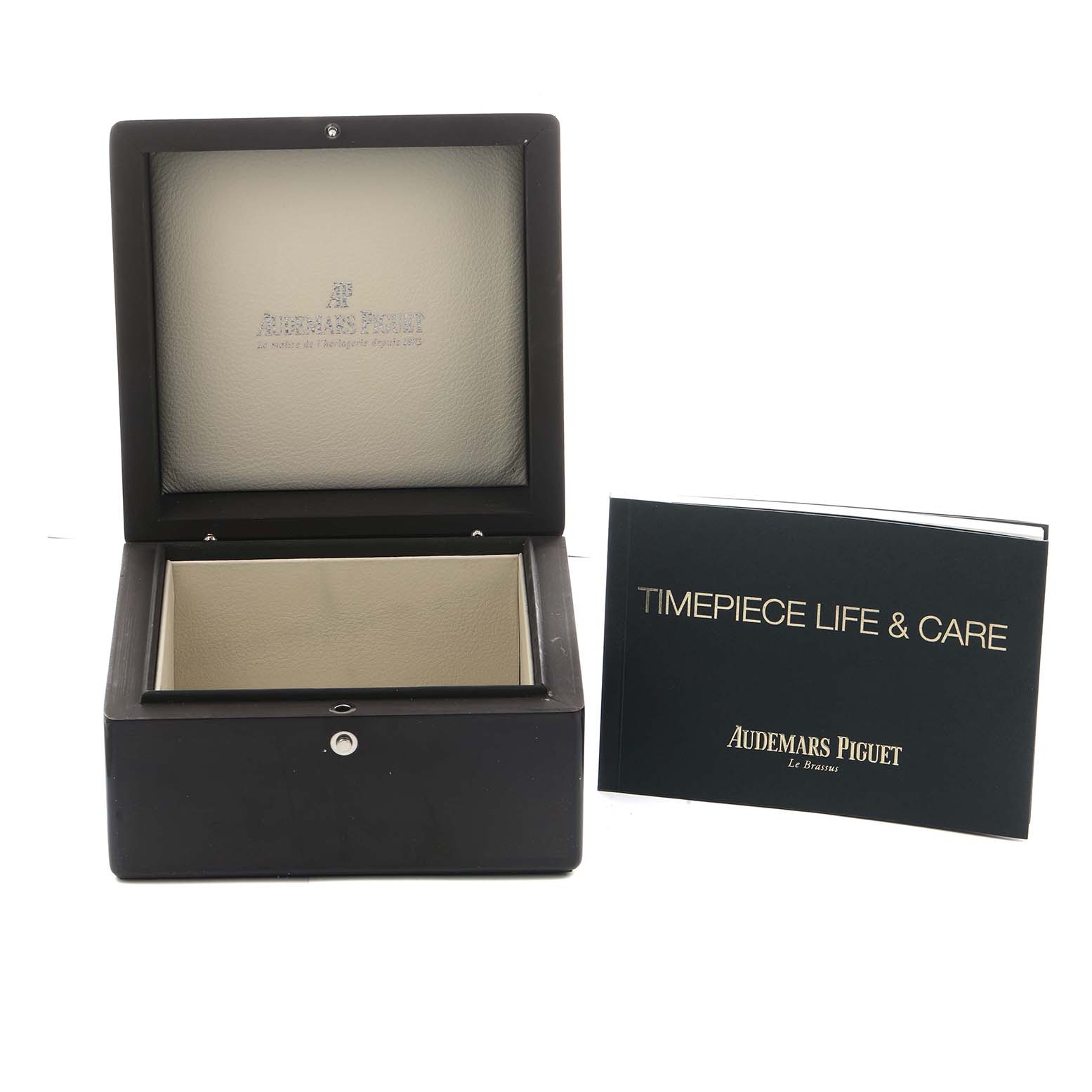 The image shows an open box for the Royal Oak by Audemars Piguet and a booklet labeled "Timepiece Life & Care."