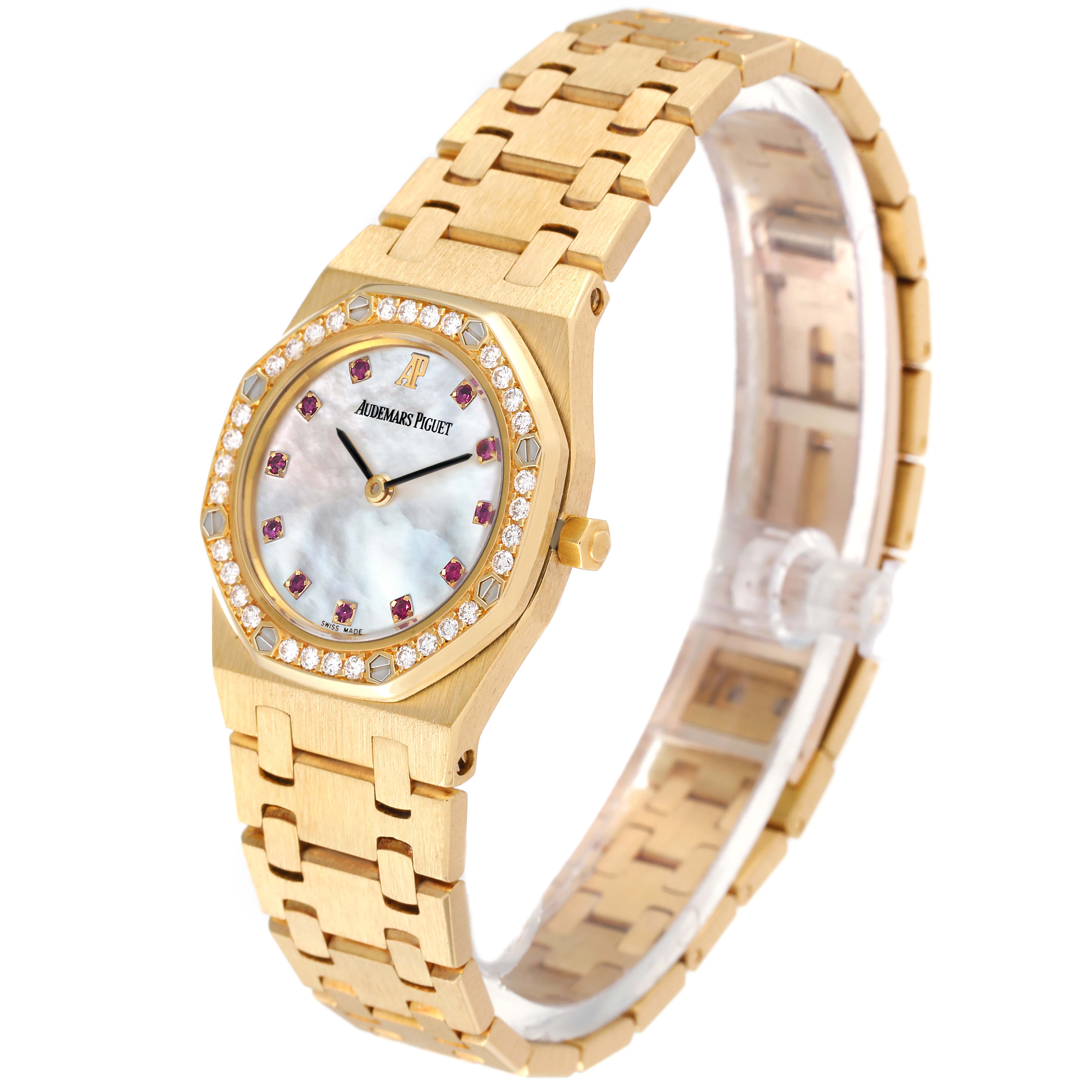 The image shows the front and side angle of an Audemars Piguet Royal Oak 66344BA Women's Yellow Gold Mother of Pearl Dial 66344BA Women's Yellow Gold Mother of Pearl Dial watch, highlighting the bracelet and bezel.