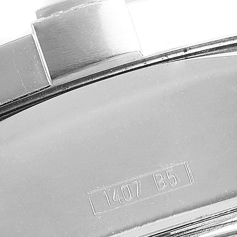 The image shows a close-up of the back of a Breitling Avenger A13381 Men's Stainless Steel Blue Dial A13381 Men's Stainless Steel Blue Dial watch with the model number 1407 B5 engraved.