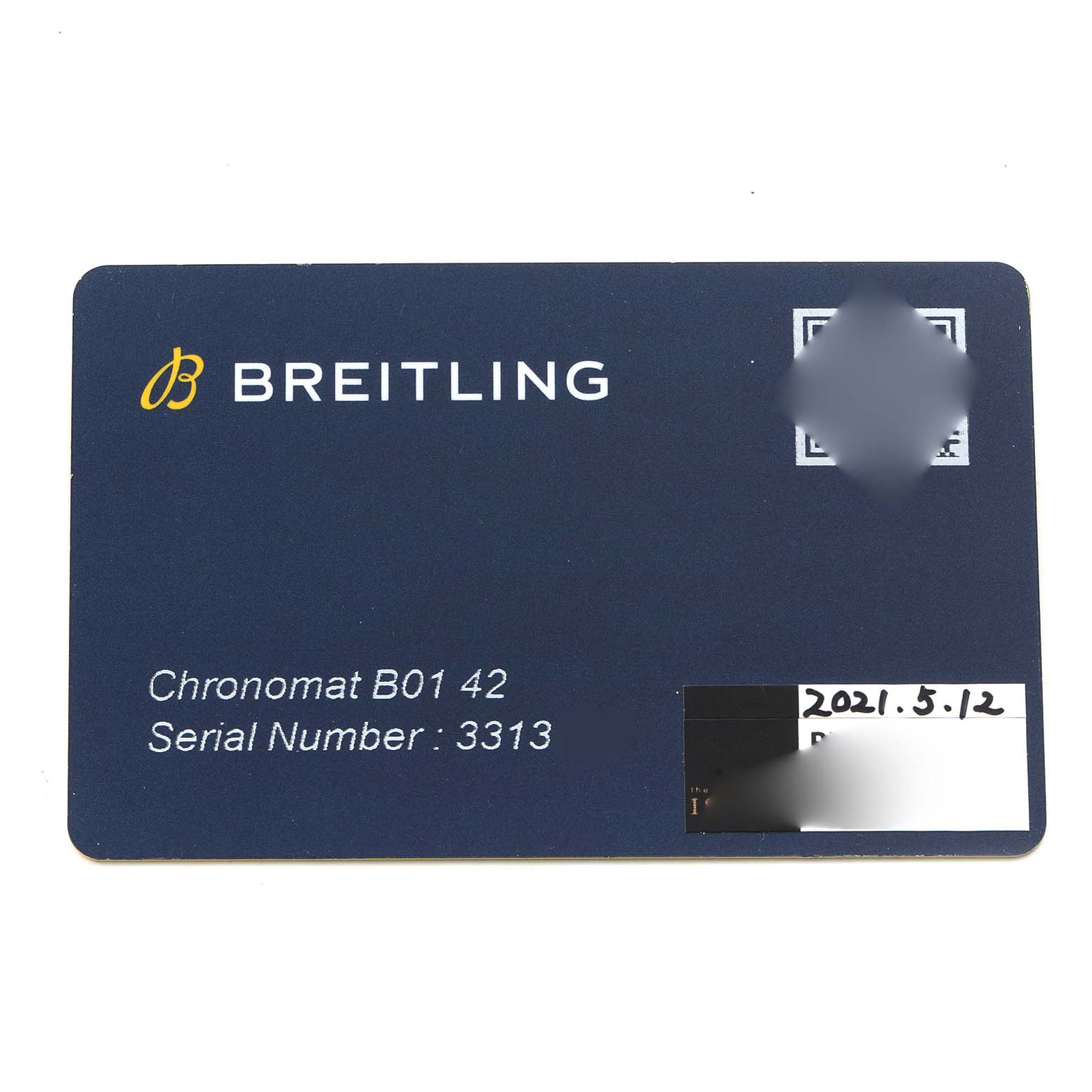The image shows a Breitling Chronomat AB0134 Men's Stainless Steel Black Dial B01 42 warranty card from a top-down angle.