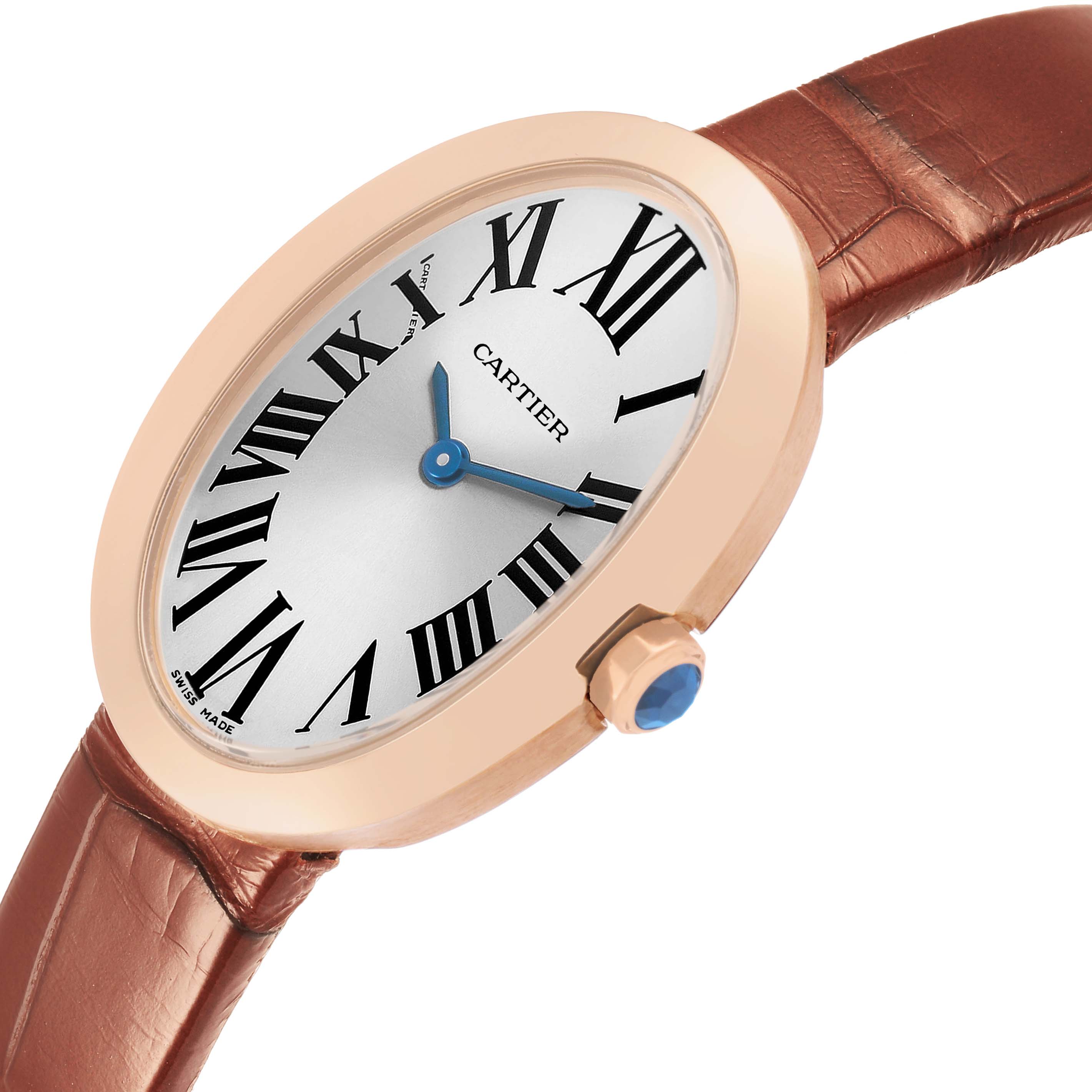 The Cartier Baignoire W8000007 Women's Rose Gold Silver Dial watch is shown at a slightly angled side view, highlighting its oval face, crown, and leather strap.