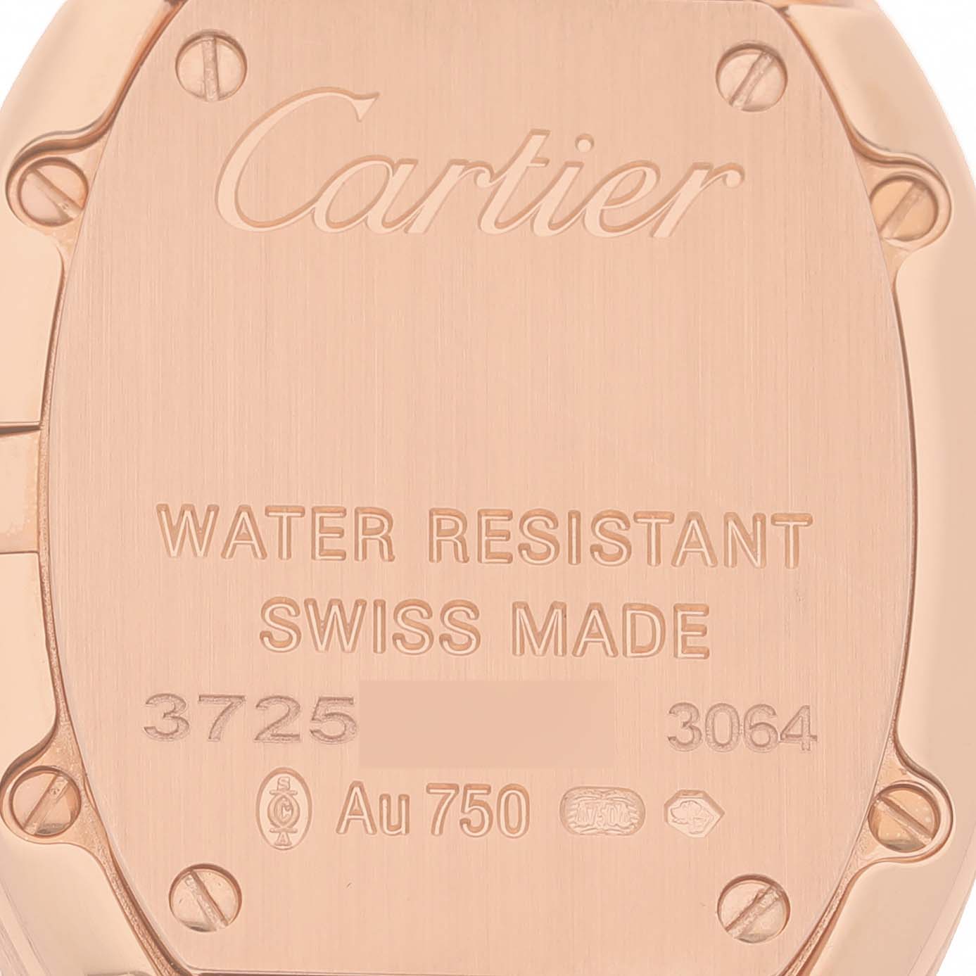 The image shows the back of a Cartier Baignoire W8000007 Women's Rose Gold Silver Dial watch, highlighting engravings and screws.