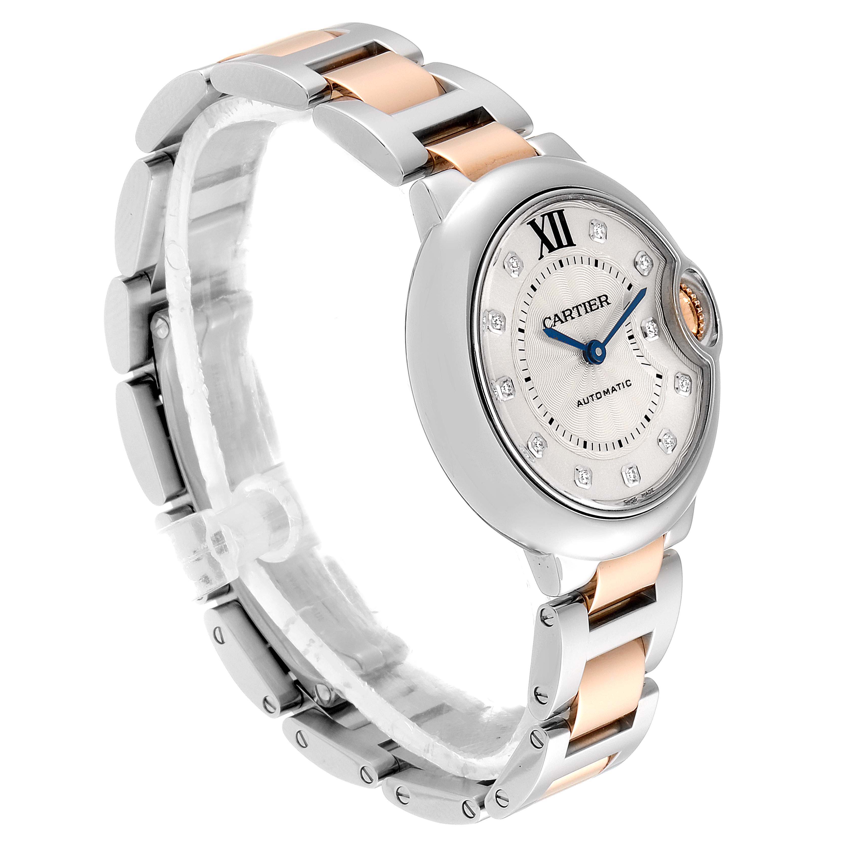 The image shows a side angle of the Cartier Ballon Bleu WE902061 Women's Steel and Gold (two tone) Silver Dial WE902061 Women's Steel and Gold (two tone) Silver Dial watch, highlighting its face, case, and two-tone metal bracelet.