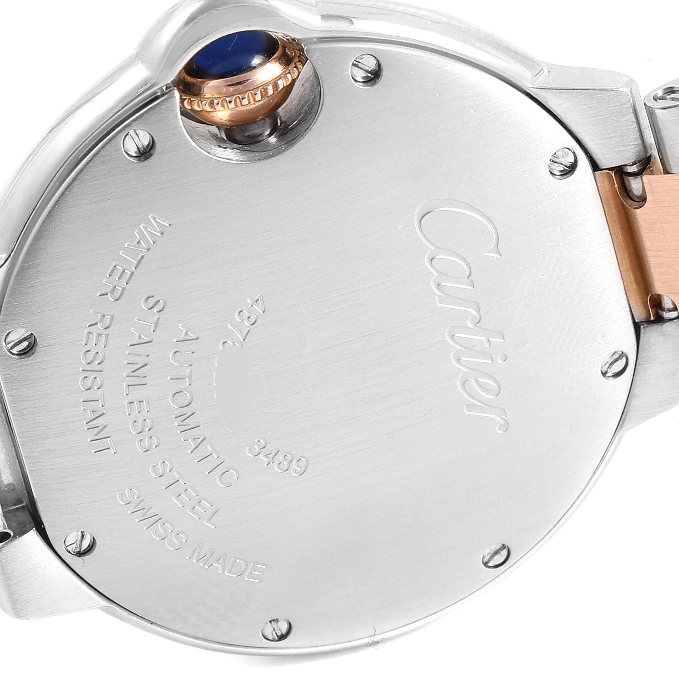 The image shows the back case and part of the band of a Cartier Ballon Bleu WE902061 Women's Steel and Gold (two tone) Silver Dial WE902061 Women's Steel and Gold (two tone) Silver Dial watch, highlighting its automatic movement and water resistance.