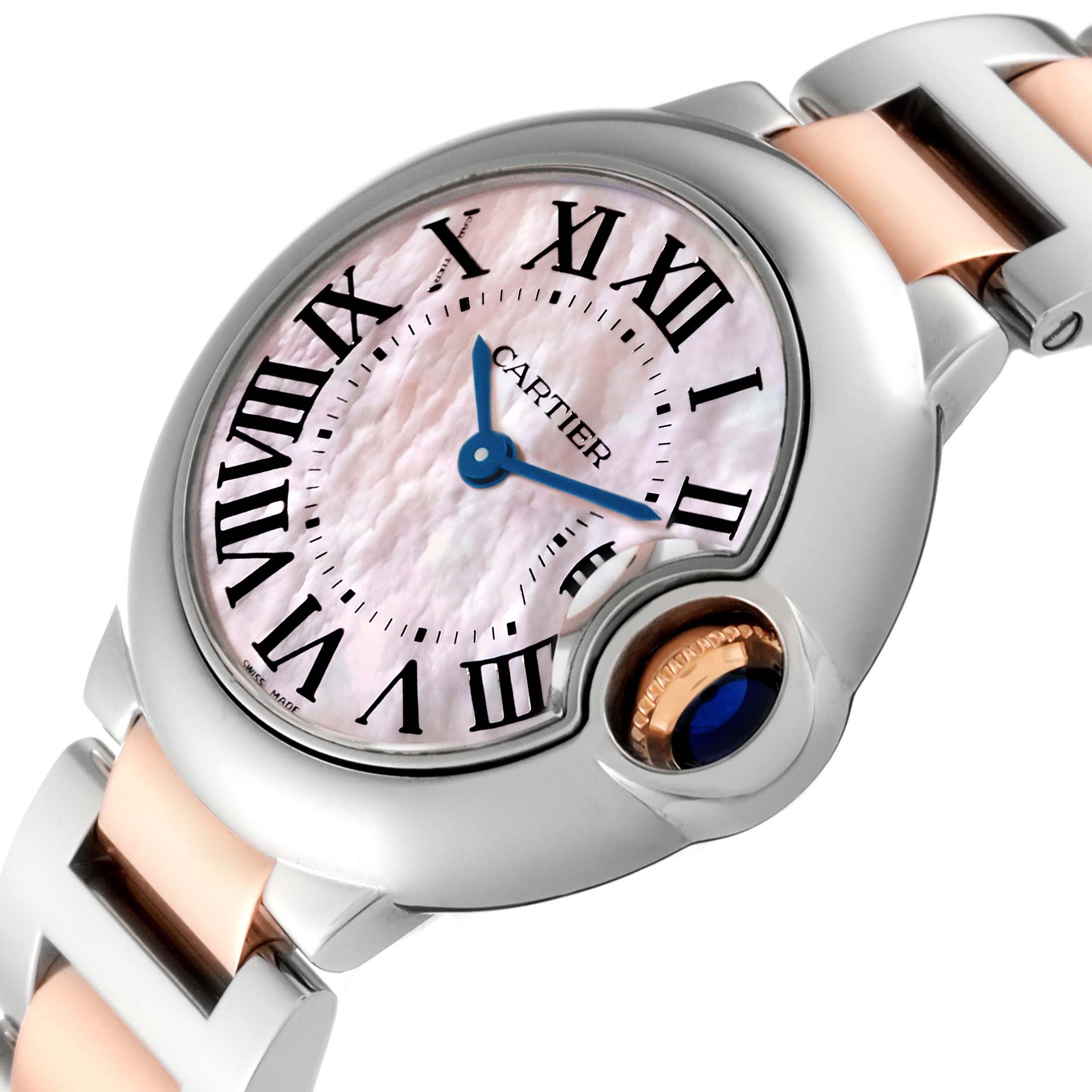 The image shows a close-up, angled view of the Ballon Bleu de Cartier watch, highlighting its dial, Roman numerals, and crown.