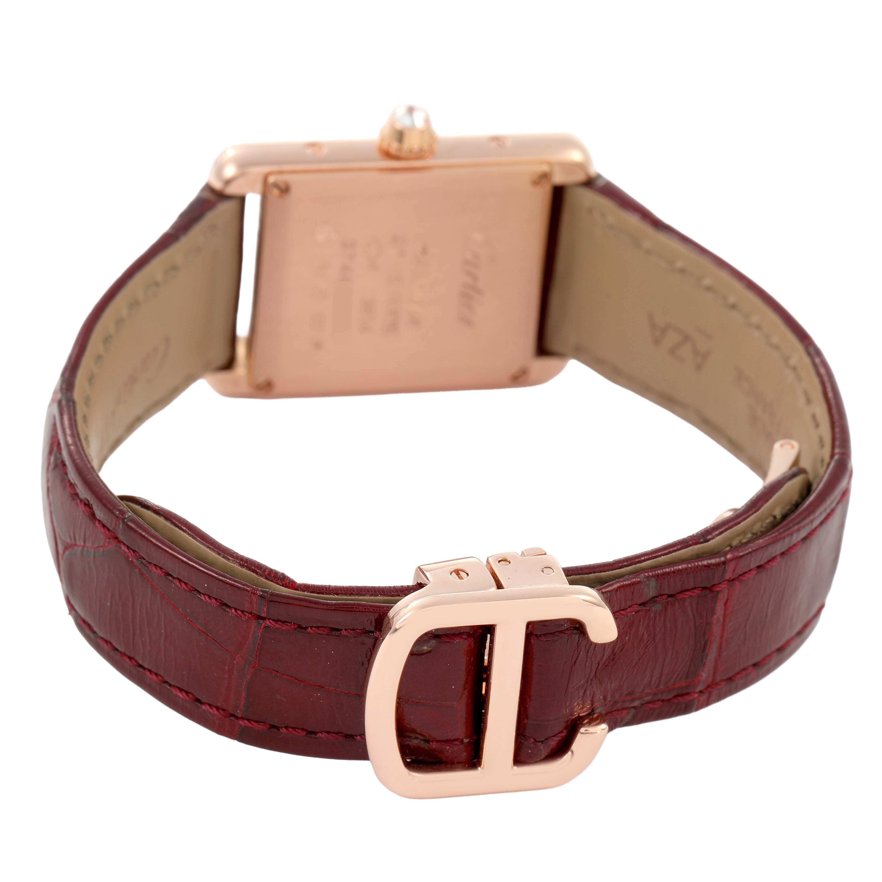 The image shows the back of a Cartier Tank Louis WJTA0010 Women's Rose Gold Silver Dial watch with a focus on the case back, crown, and leather strap with a buckle.