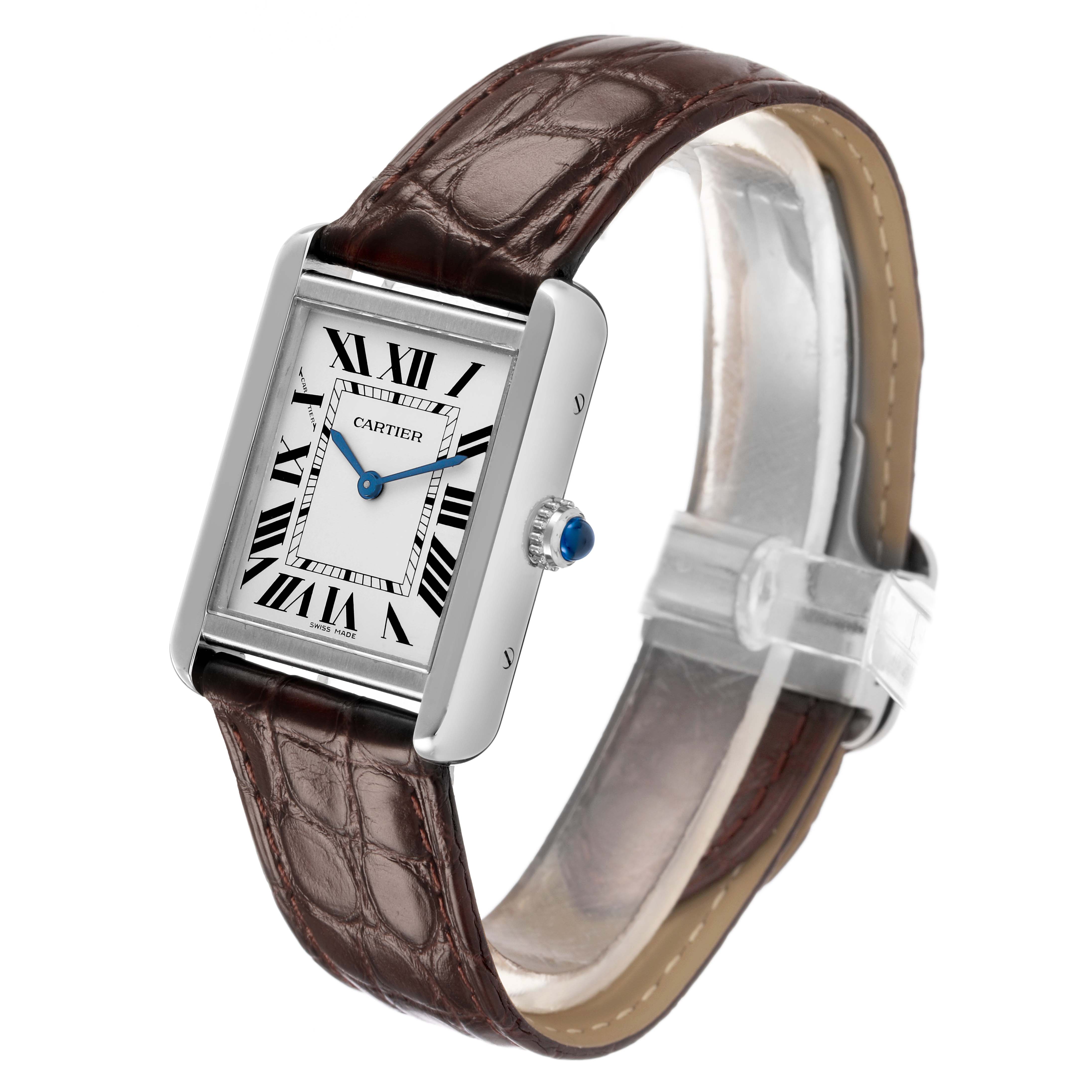 The Cartier Tank Solo WSTA0030 Womens Stainless Steel Silver Dial watch is shown in a three-quarter angle, highlighting its rectangular face with Roman numerals, brown leather strap, and crown.