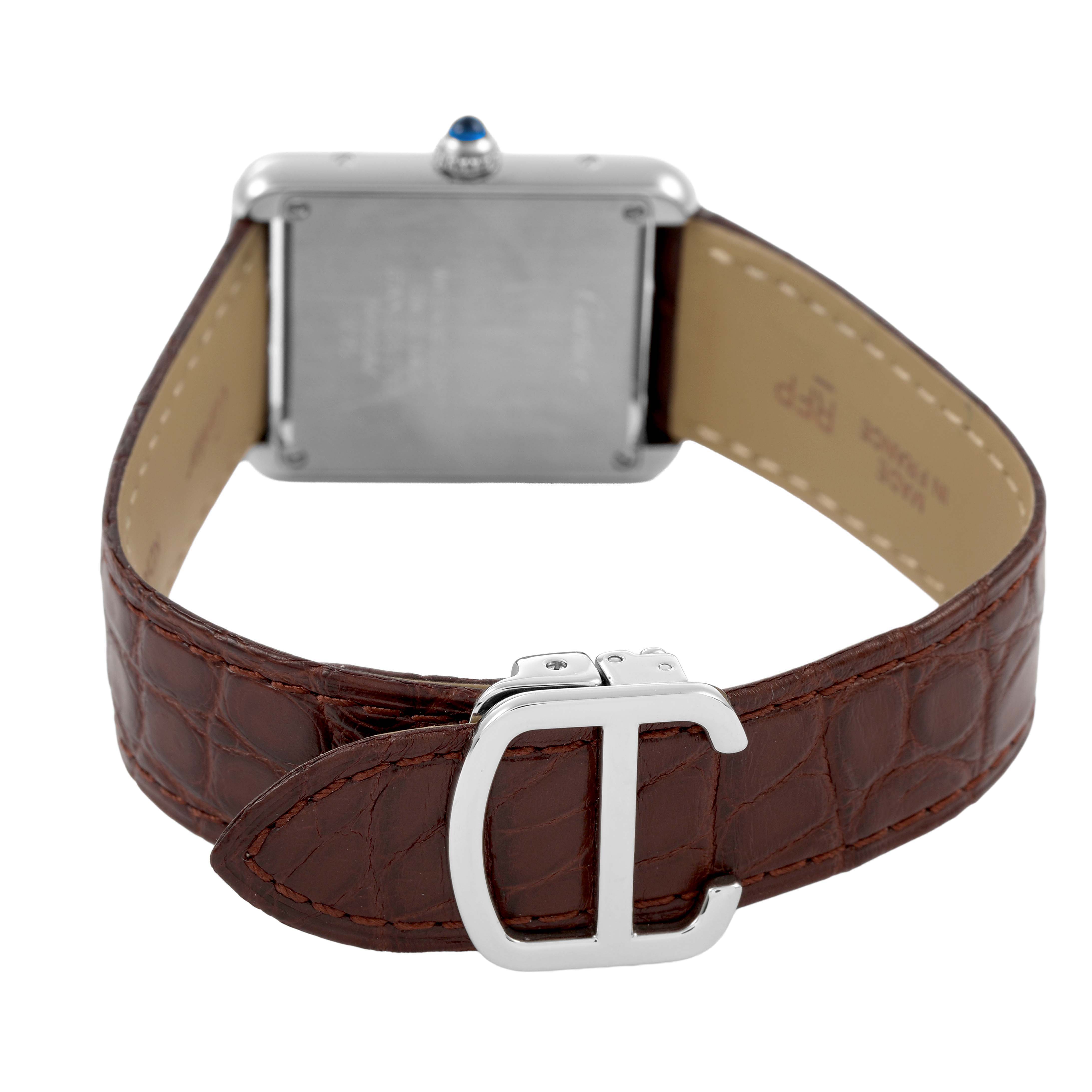 The image shows the back of the Cartier Tank Solo WSTA0030 Womens Stainless Steel Silver Dial watch, highlighting its case, strap, and metal buckle.