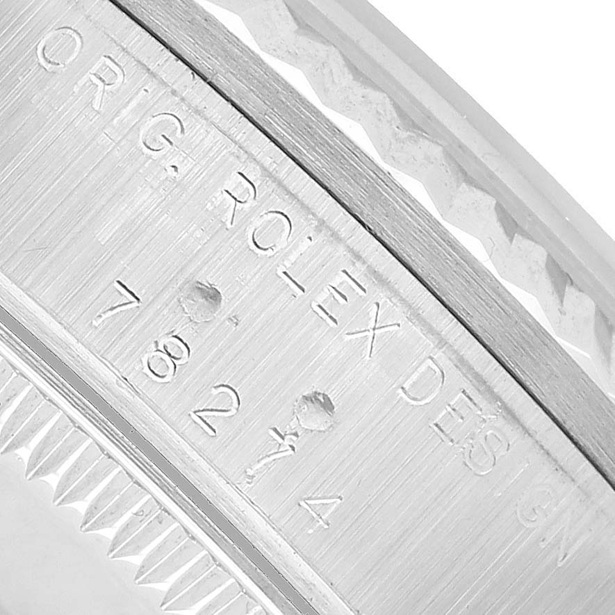 This image shows a close-up of the watch's side with engraved text, but it's a Rolex, not an Omega Seamaster 212.30.41.20.03.001 Men's Stainless Steel Blue Dial.