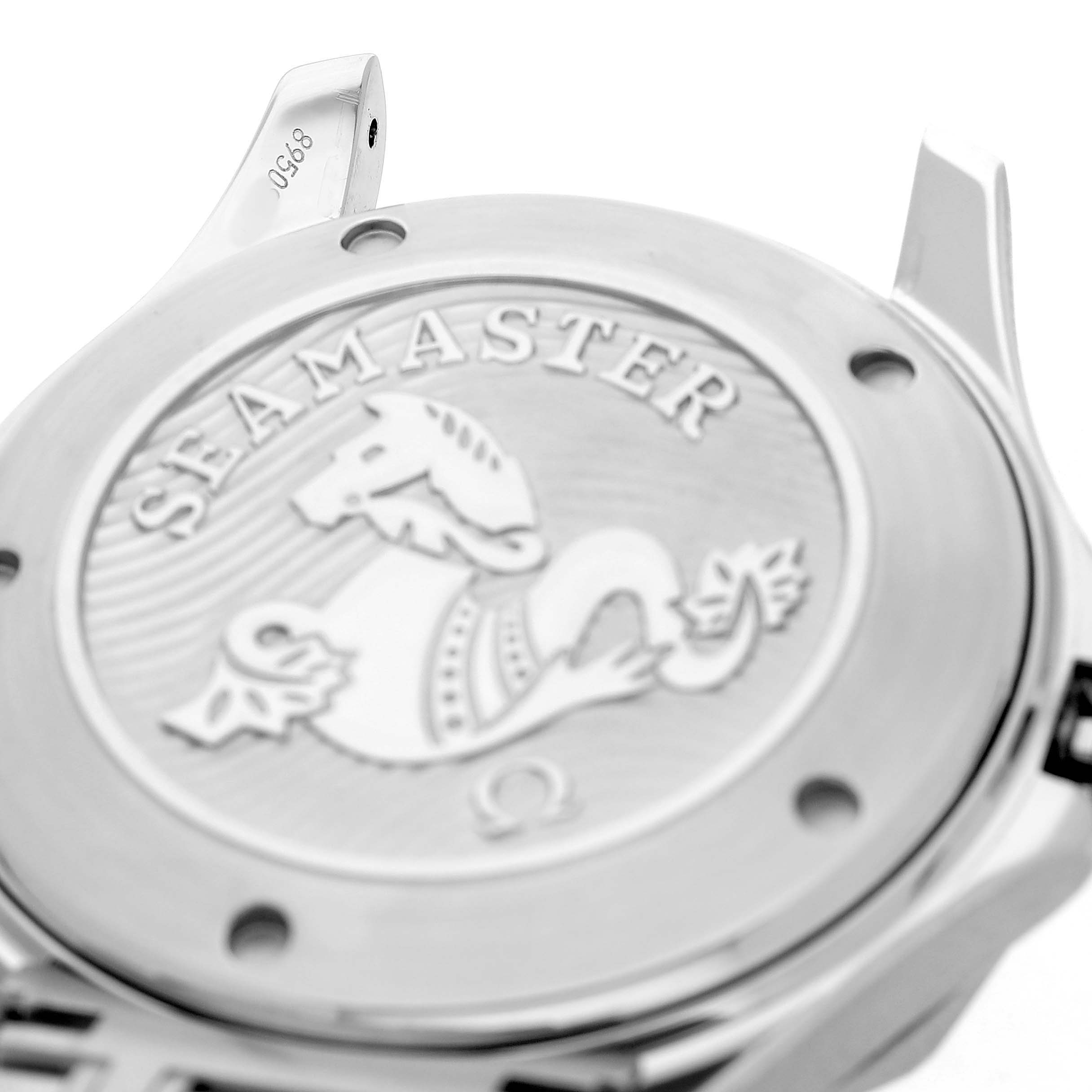 The image shows the case back of an Omega Seamaster 212.30.41.20.03.001 Mens Stainless Steel Blue Dial, featuring its engraved design and lug area.